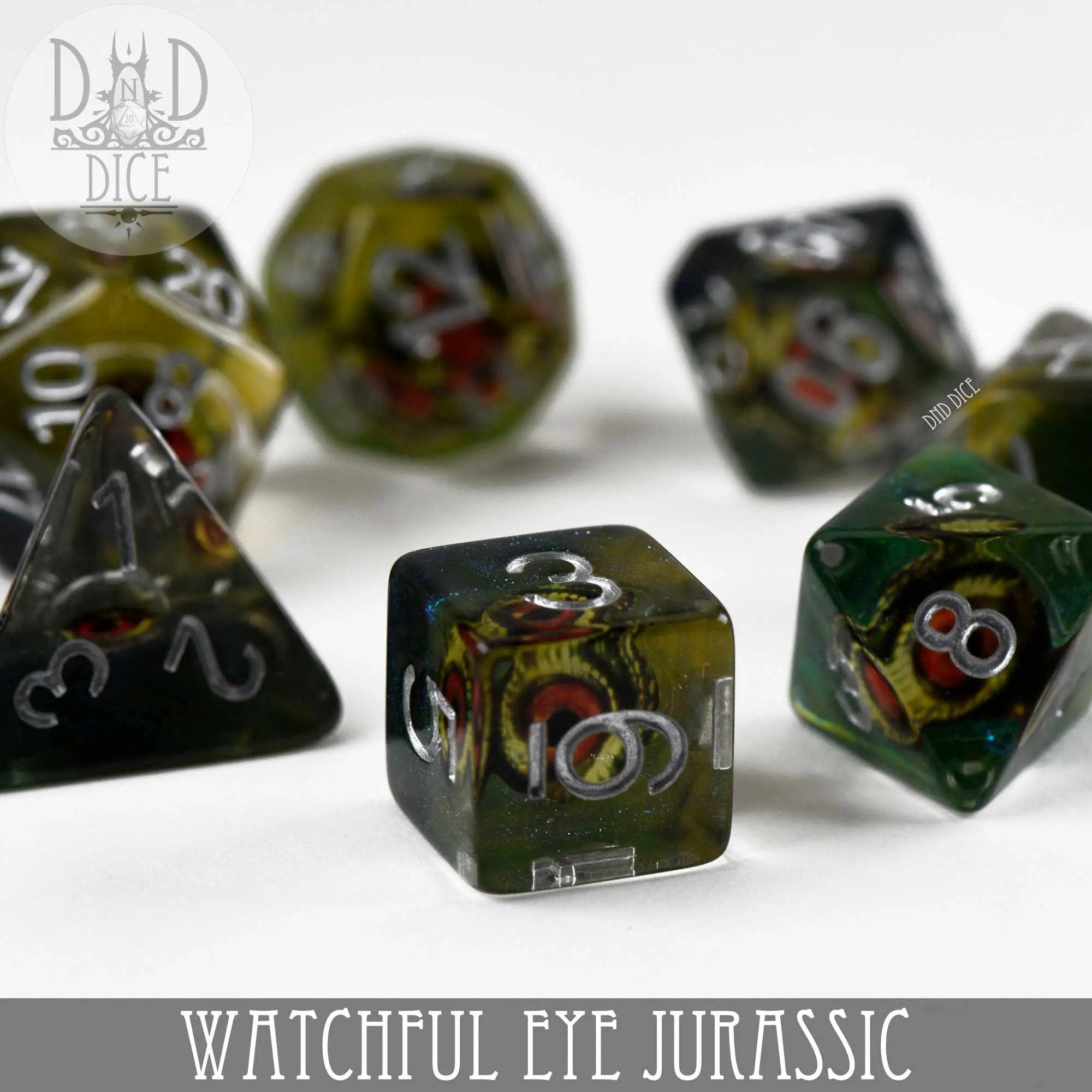 Jurassic Dice Set featuring dinosaur-themed dice for tabletop games, with colorful, detailed designs in a display case.