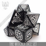 Black Yennefer-themed dice set and coin from The Witcher, featuring detailed dice and a collectible coin for tabletop gaming.