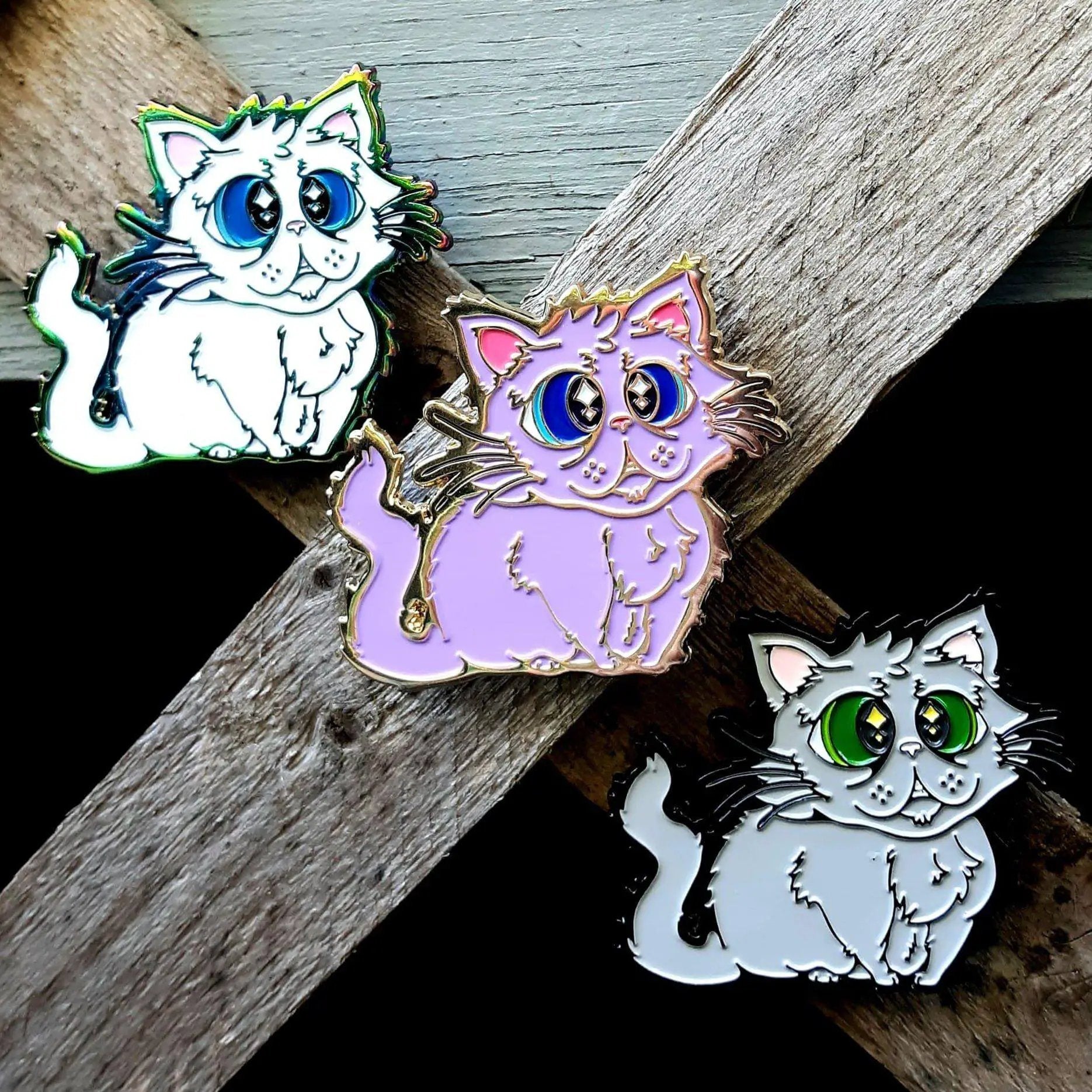 Kolorspun Floofy Kitty enamel pin featuring a cute, fluffy cat design on a white background.