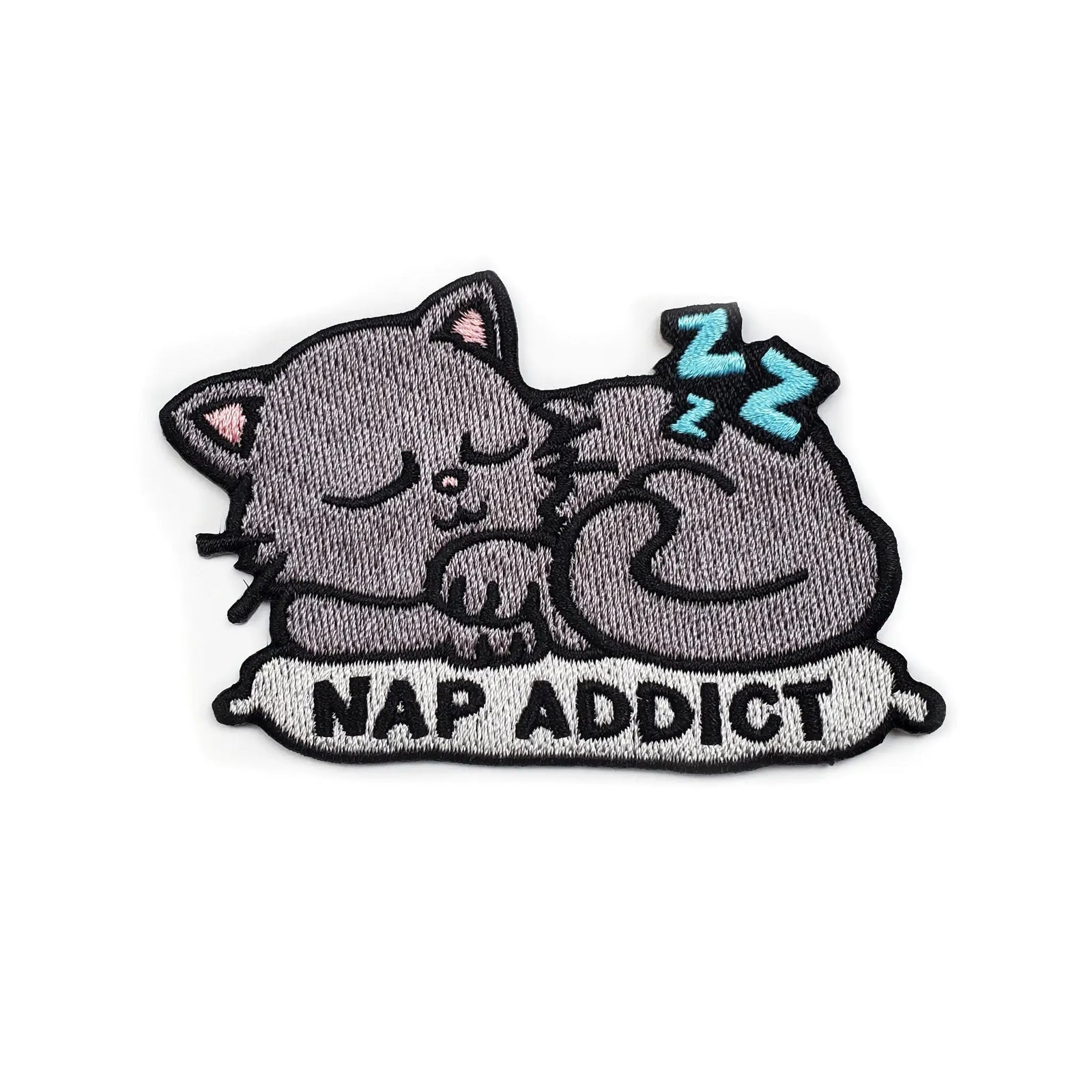 Kolorspun Nap Addict Patch shown in a close-up, featuring a colorful design on a fabric patch for sleep or relaxation.