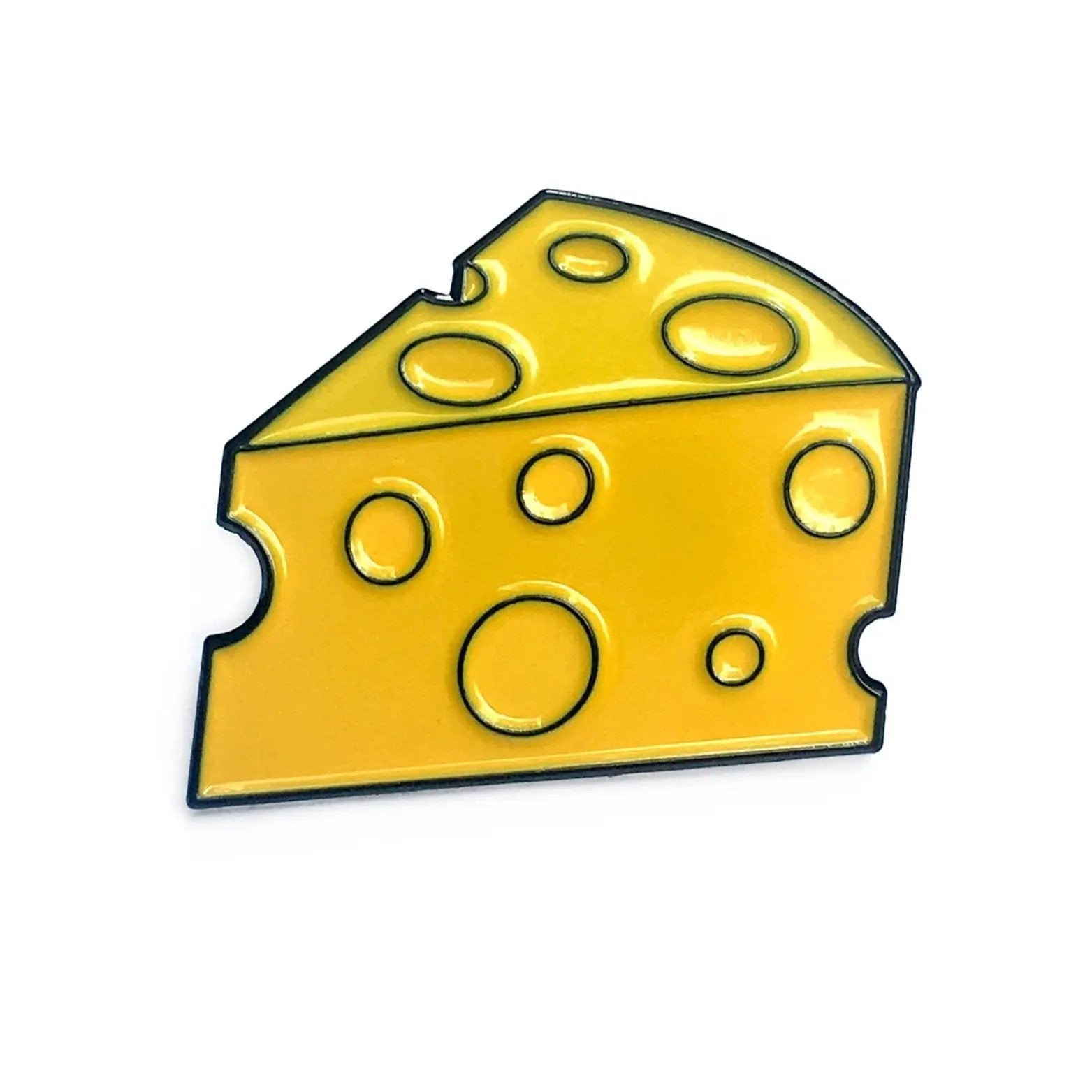 Kolorspun cheese-themed golf ball marker with a detailed cheese design, used for marking golf balls on the green.