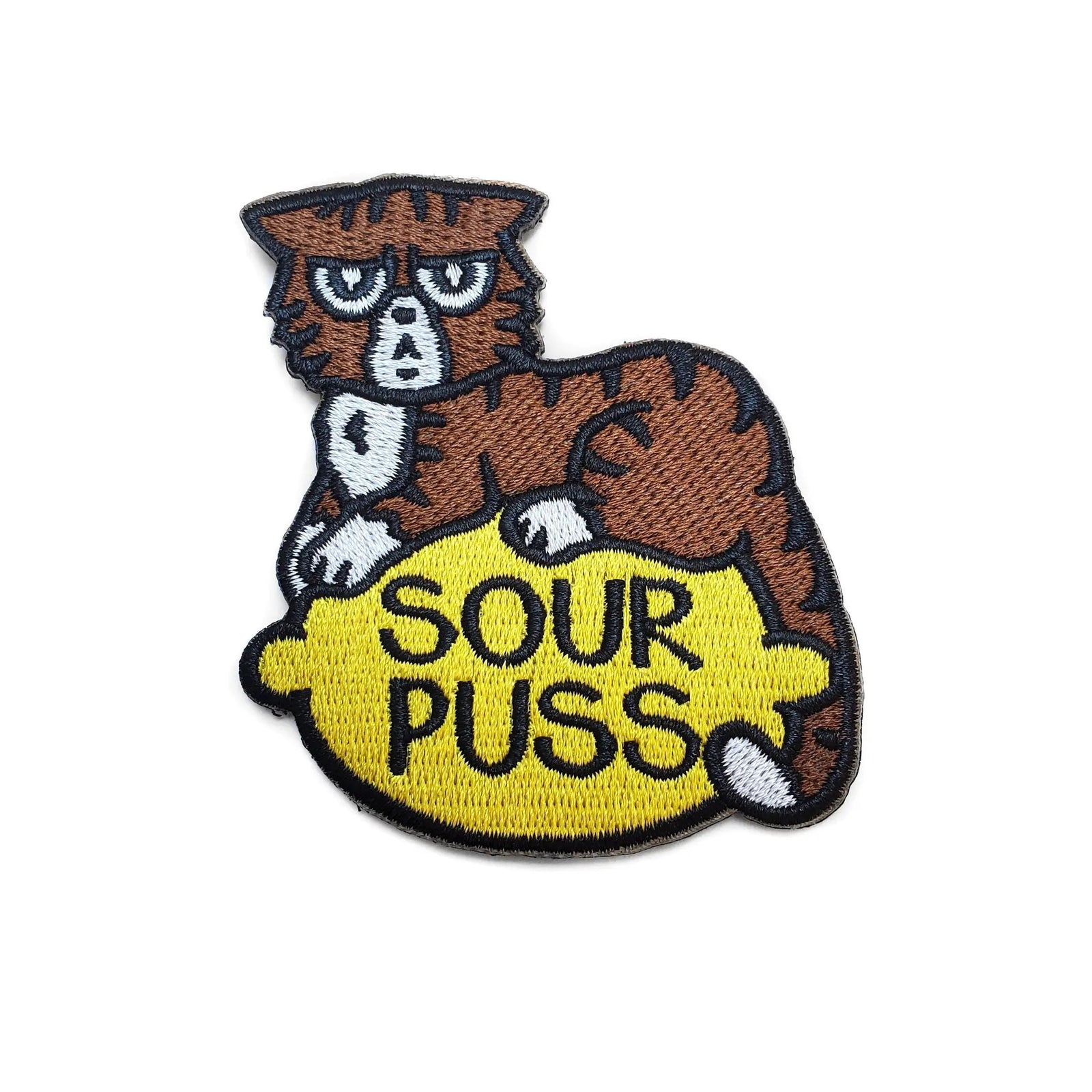 Sourpuss Cat Patch by Kolorspun featuring a colorful cartoon cat design on a fabric patch for clothing or accessories.