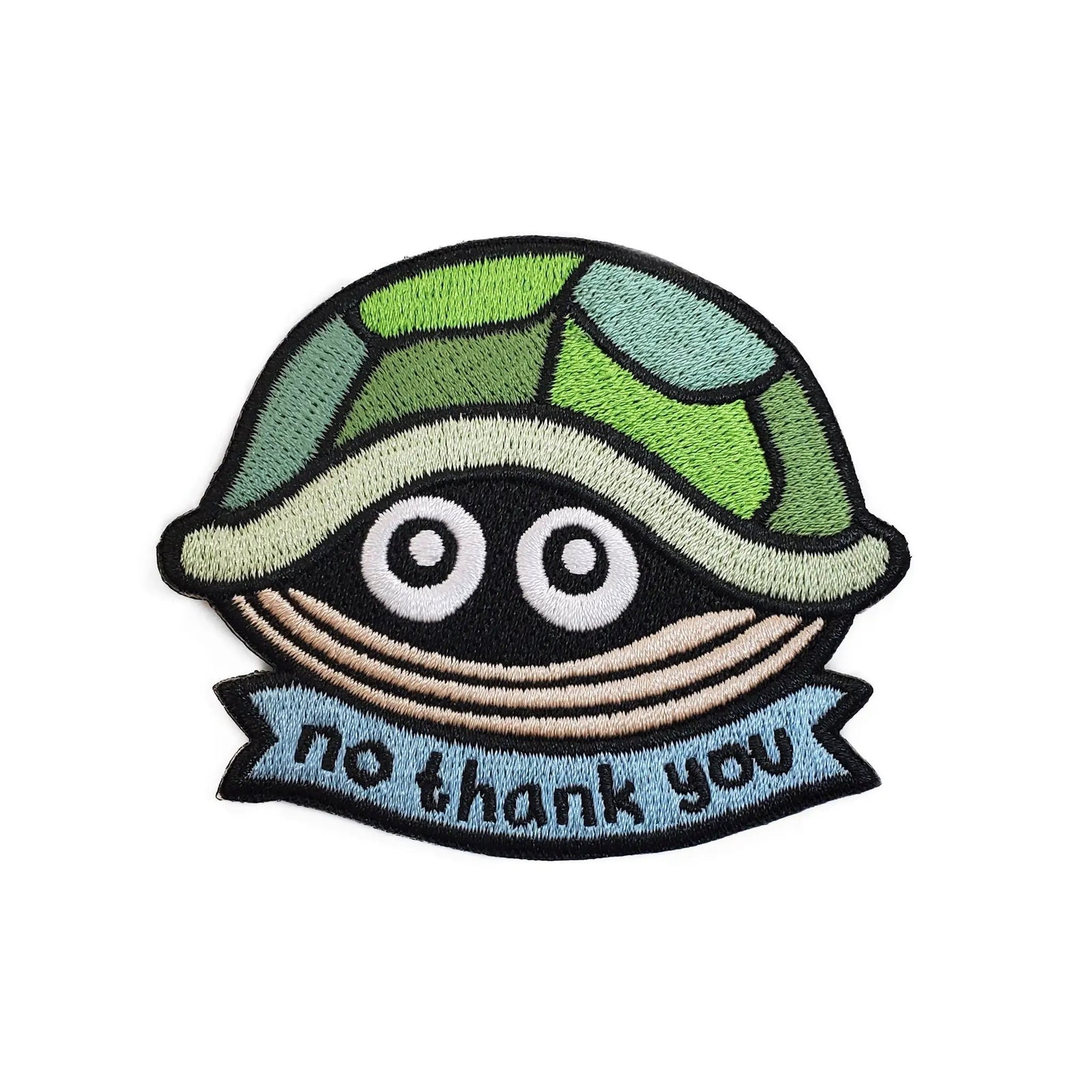 Kolorspun No Thank You Turtle patch sewn onto fabric, showcasing a colorful turtle design on a patch for clothing or accessories.