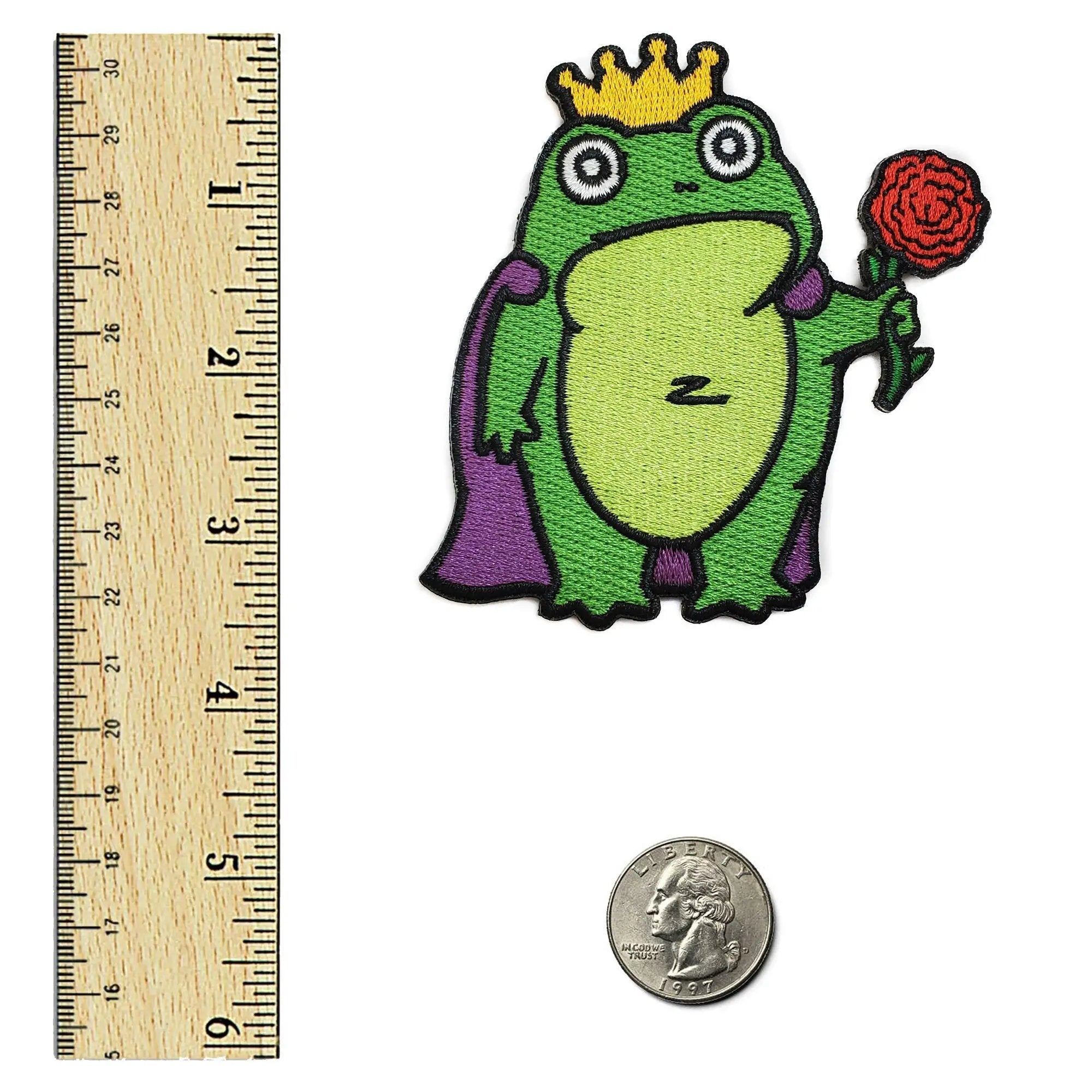 Colorful Frog Prince patch by Kolorspun featuring a whimsical frog design on fabric for clothing or accessories.
