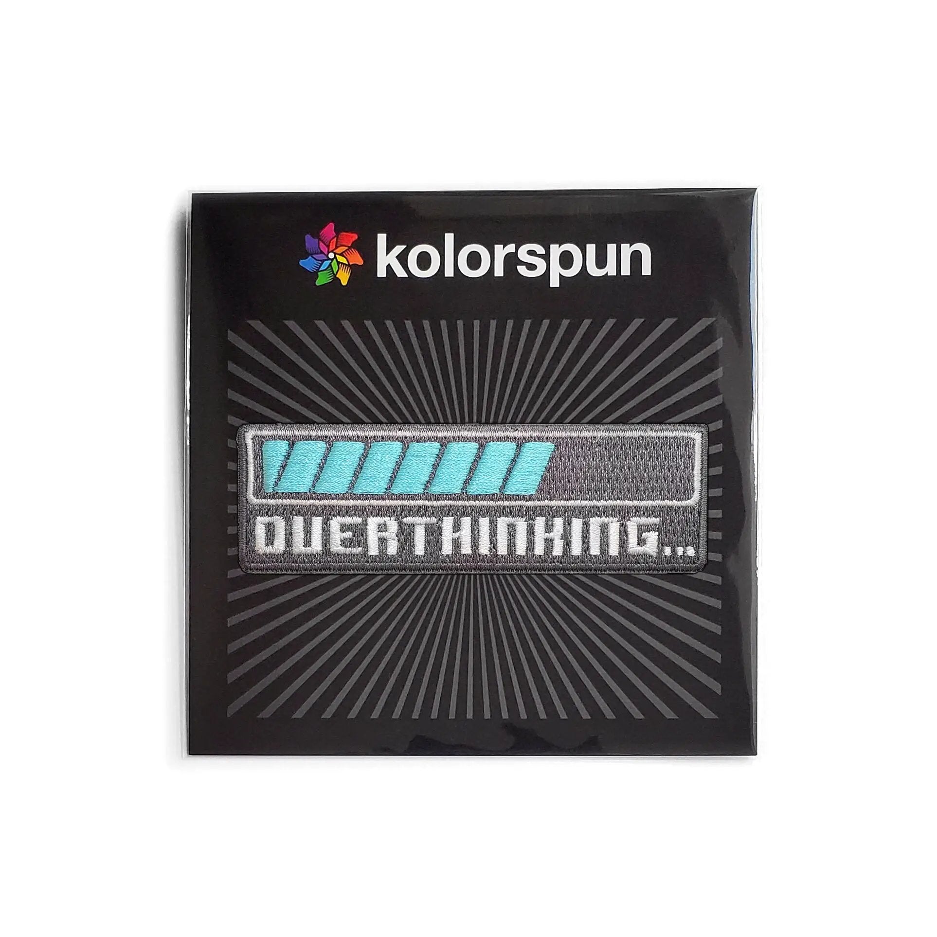 Kolorspun Overthinking Patch showing colorful fabric patch with embroidered design on a neutral background.
