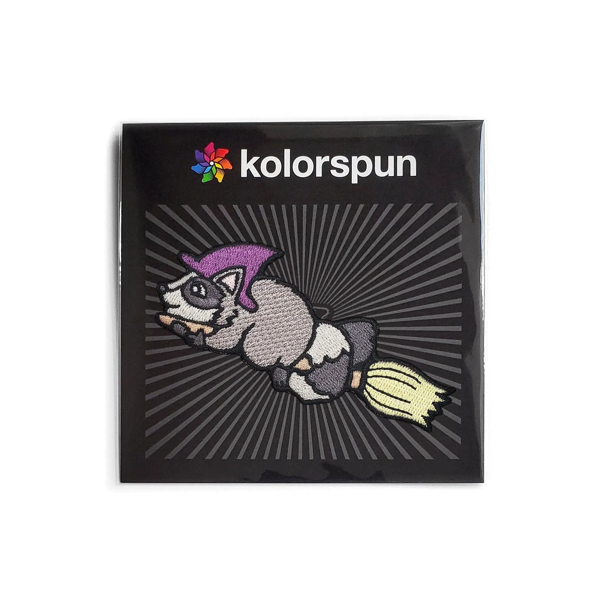 Kolorspun Raccoon Witch Patch featuring a playful raccoon wearing a witch hat, sewn fabric patch for clothing or accessories.
