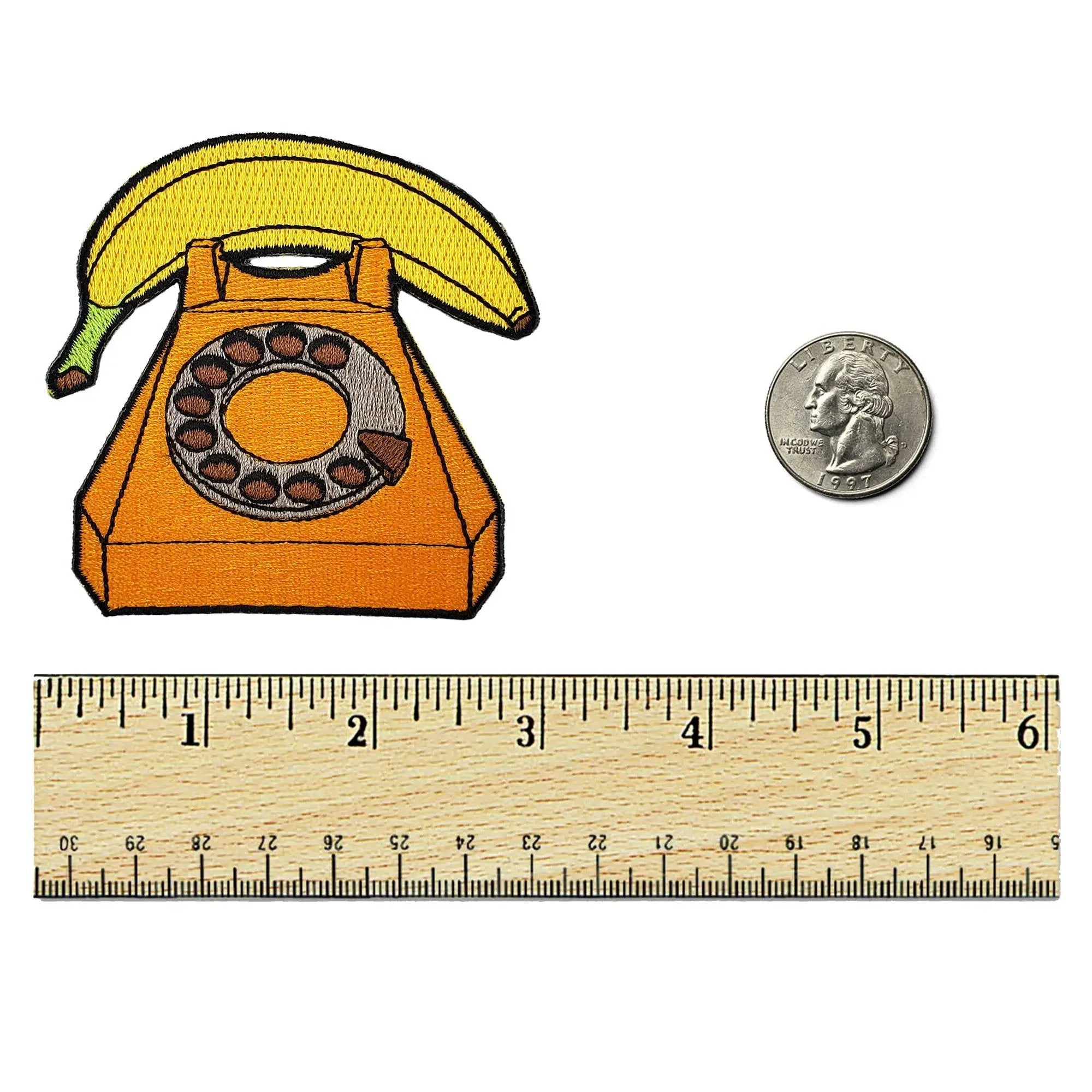 Kolorspun Banana Phone Patch sewn onto fabric, colorful patch featuring a banana design for decorative use.