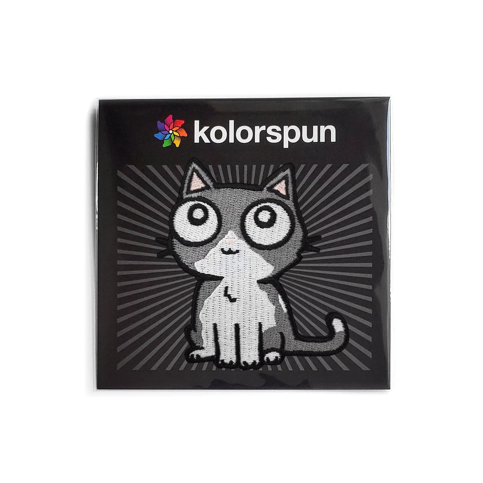 Gray Kolorspun cat patch sewn onto fabric, featuring a cute feline design perfect for clothing or accessories.