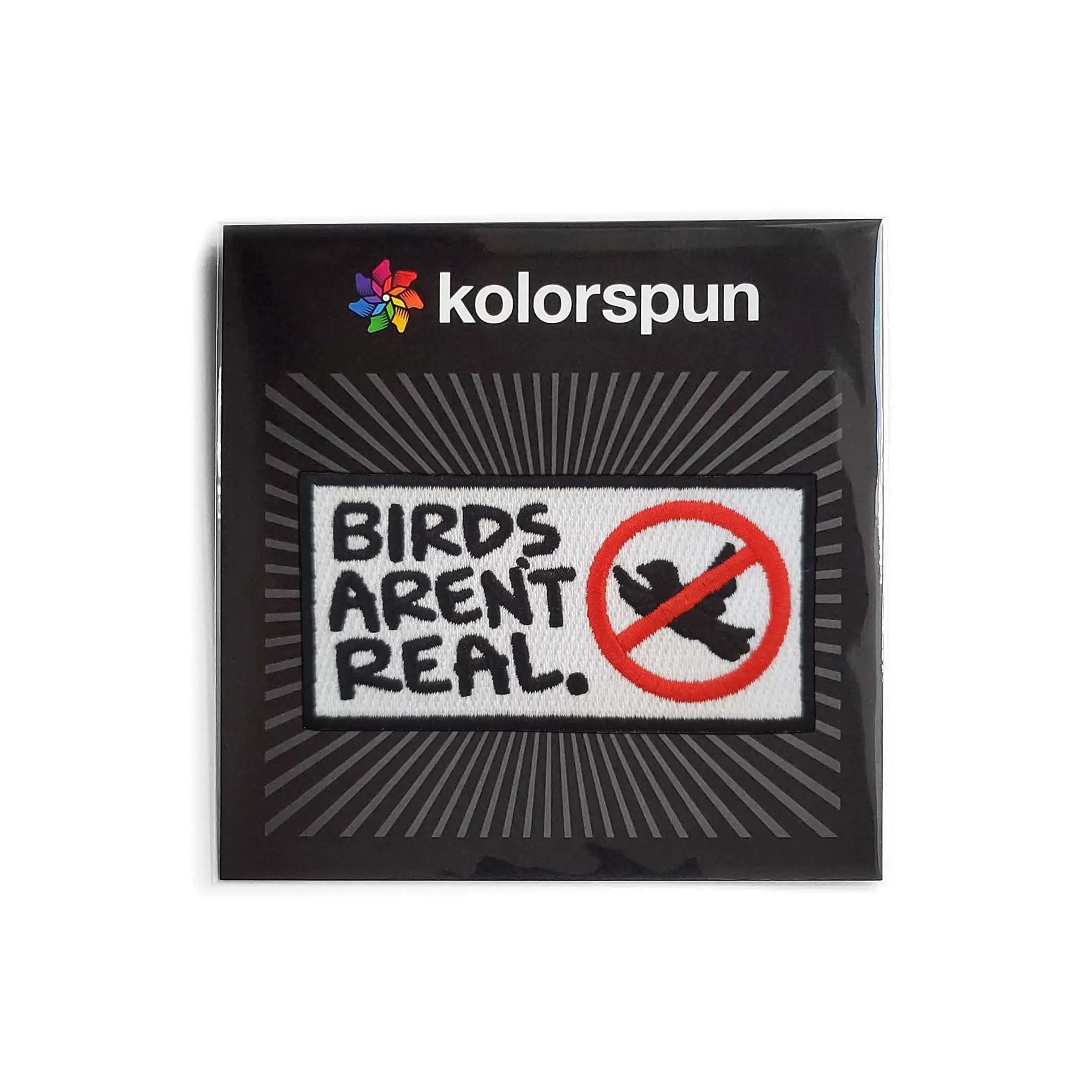 Kolorspun Birds Aren't Real Patch showing a colorful embroidered patch with bird design on fabric background.