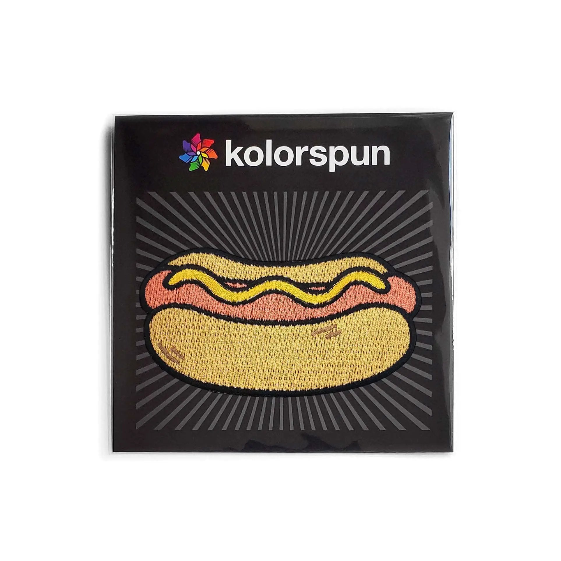 Colorful Kolorspun Hot Dog patch featuring a playful hot dog illustration on a fabric patch.