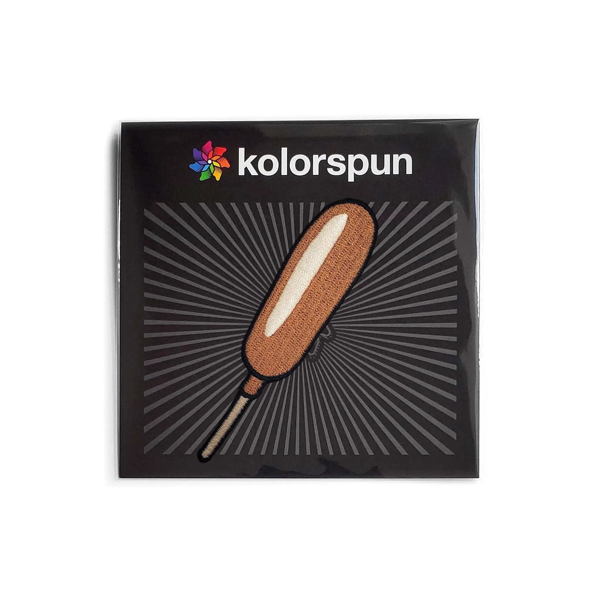 Kolorspun Corn Dog Patch featuring a colorful corn dog design on a fabric patch for clothing or accessories.