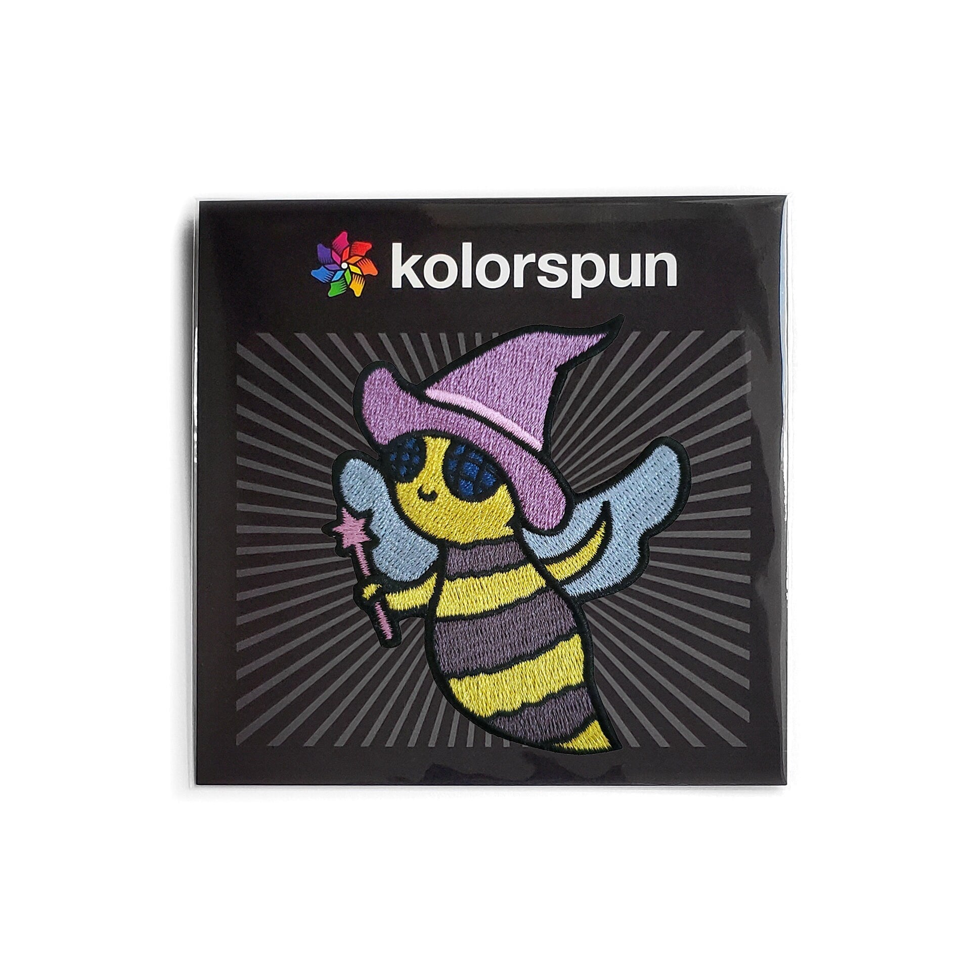 Kolorspun Bee Witch Patch featuring a colorful embroidered bee design on fabric patch for clothing or accessories.