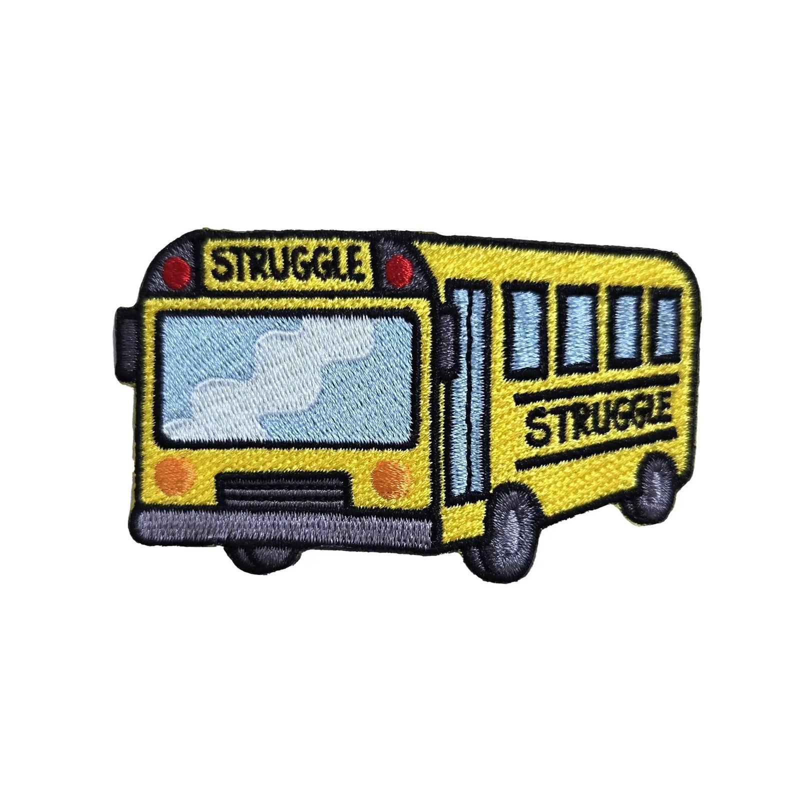 Kolorspun struggle bus patch sewn onto fabric, featuring a colorful embroidered design of a bus for clothing or accessories.
