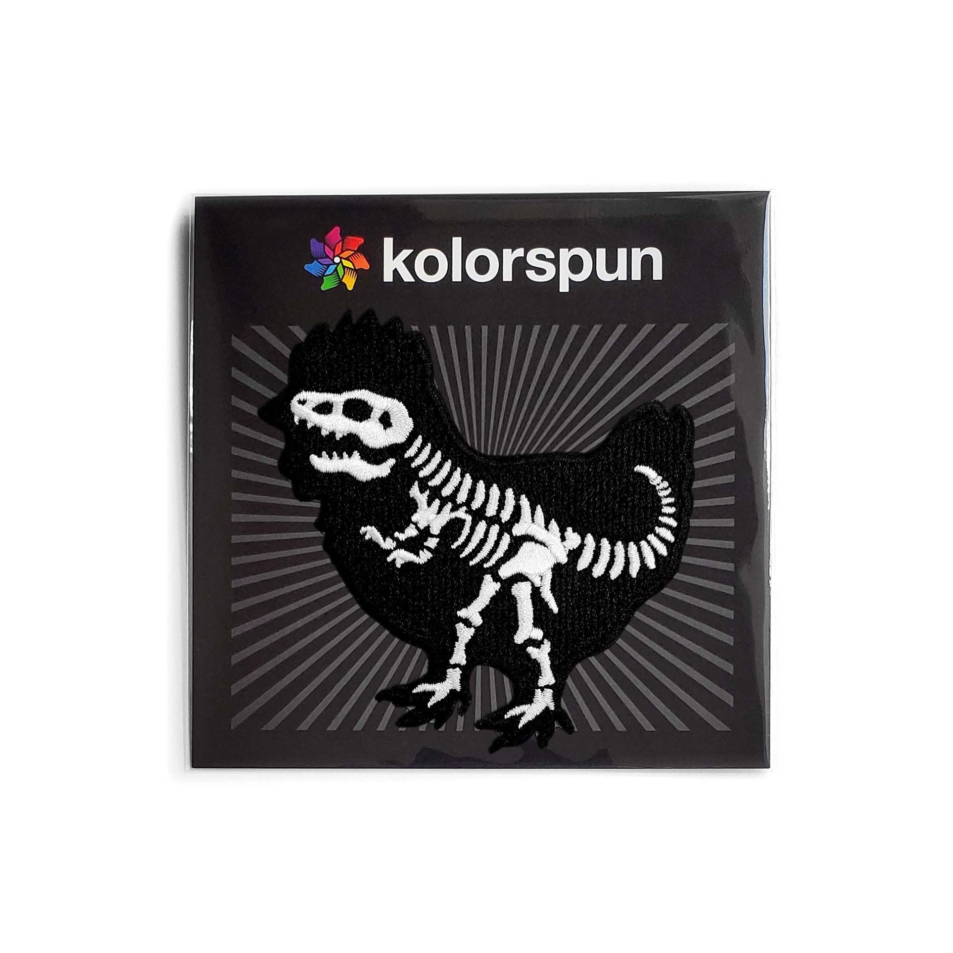 Colorful Chicken Dinosaur Patch by Kolorspun, featuring a playful dinosaur design on fabric patch for clothing or accessories.