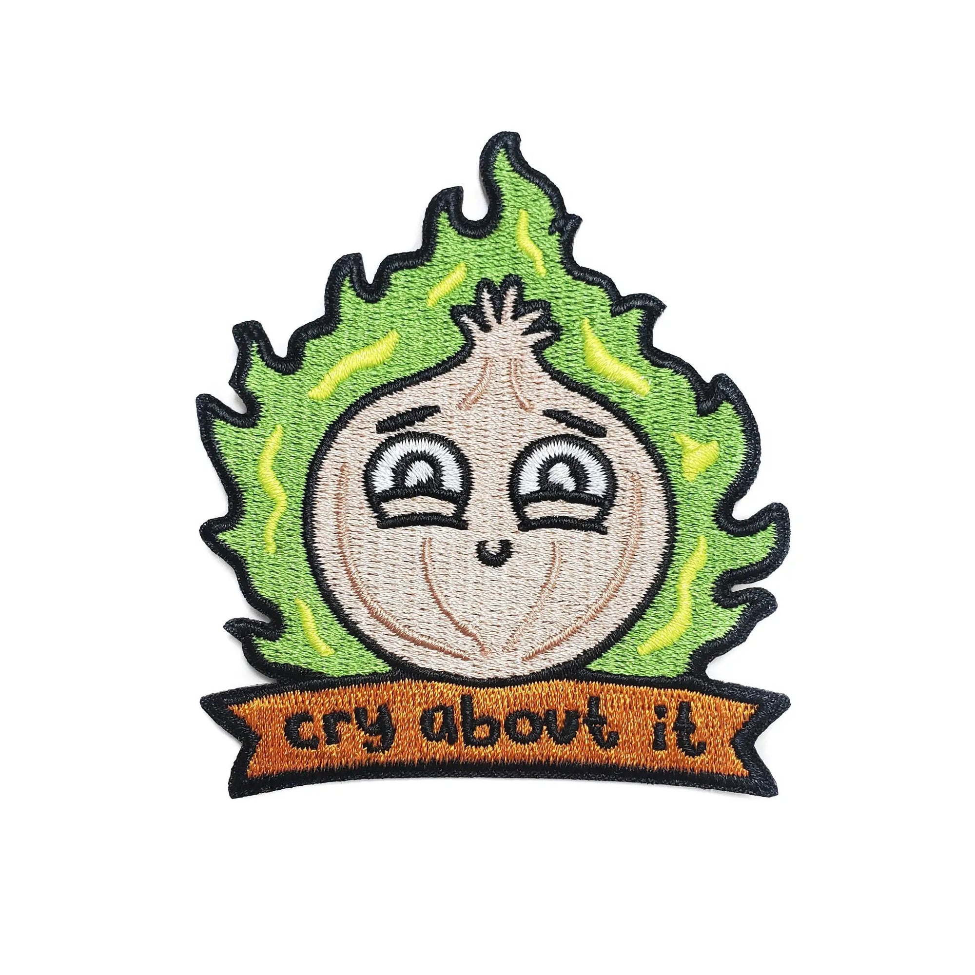 Kolorspun Cry About It Onion Patch sewn onto fabric, featuring a colorful cartoon onion with expressive face and playful design.