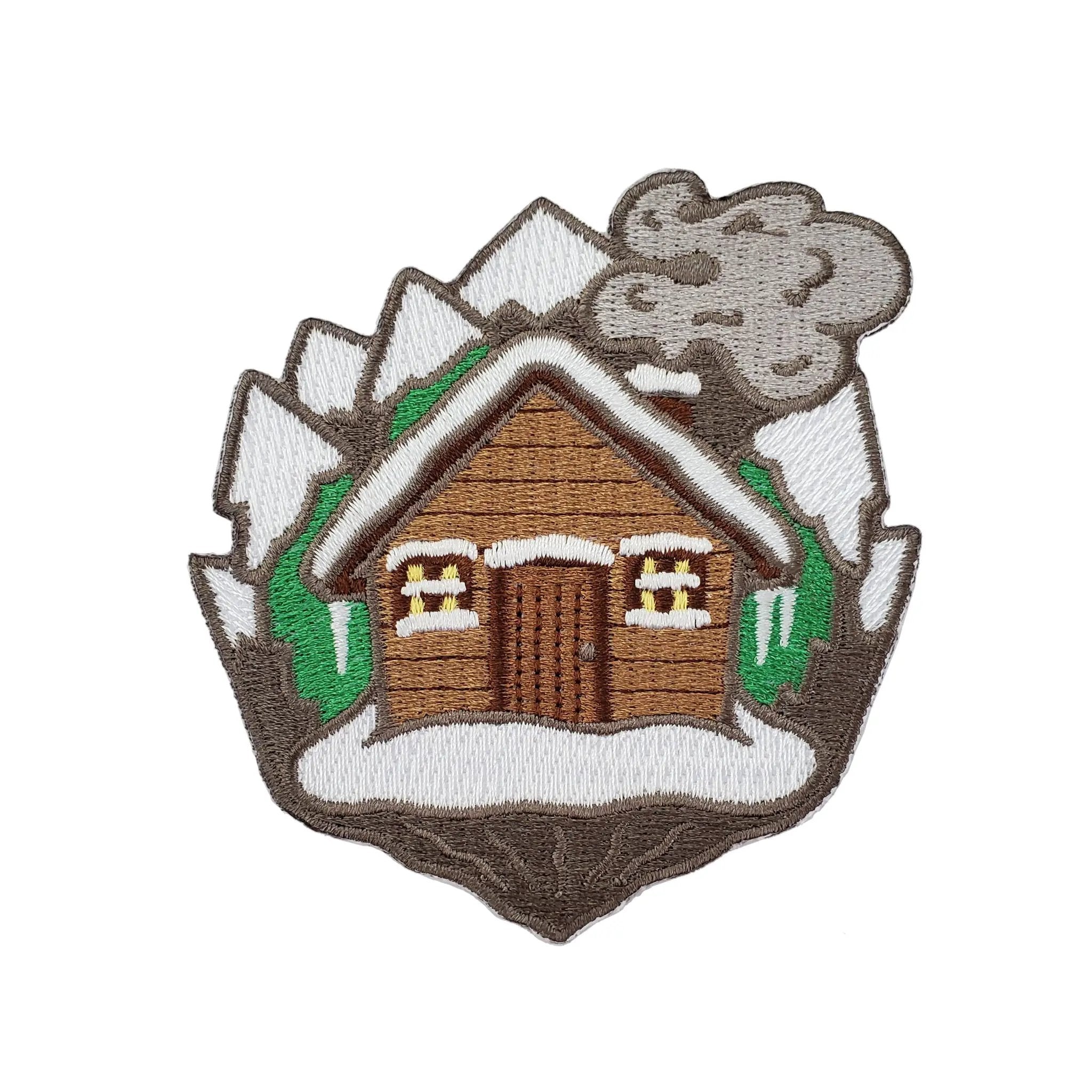 Kolorspun Log Cabin Patch featuring detailed embroidered design on fabric background, ideal for sewing or decorating clothing.