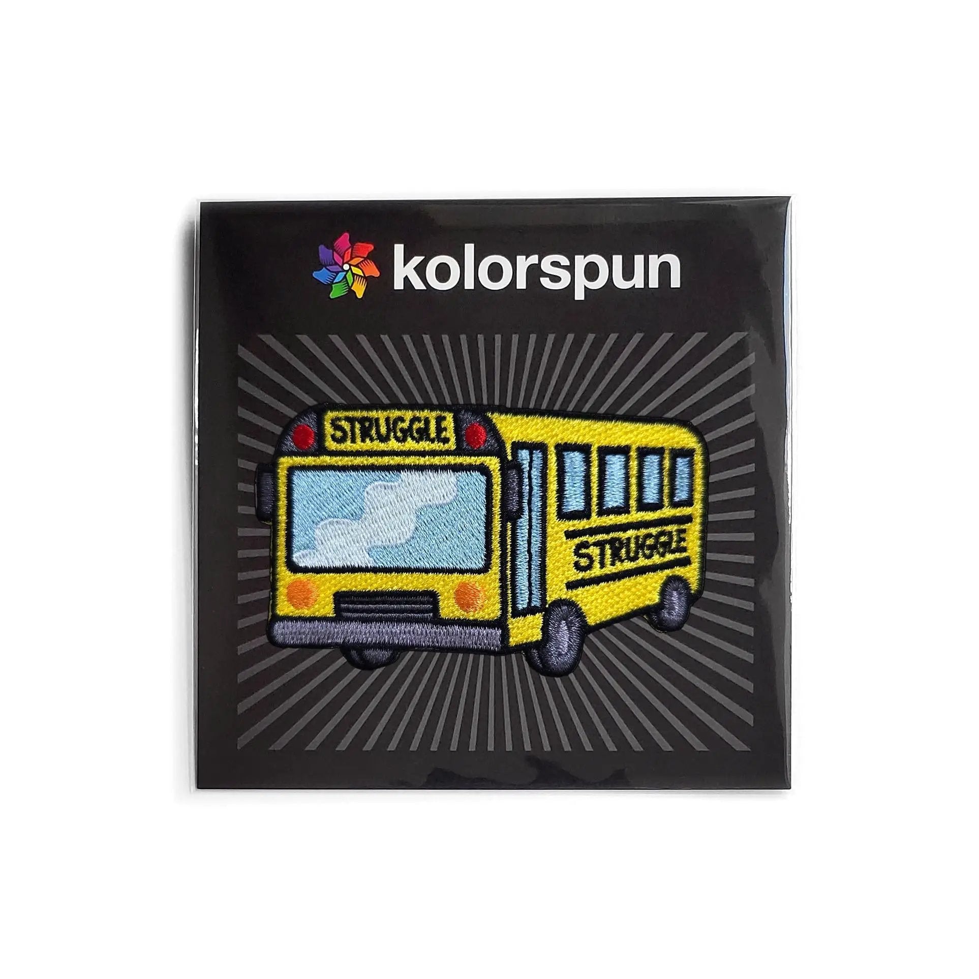 Kolorspun struggle bus patch sewn onto fabric, featuring a colorful, embroidered design for clothing or accessories.