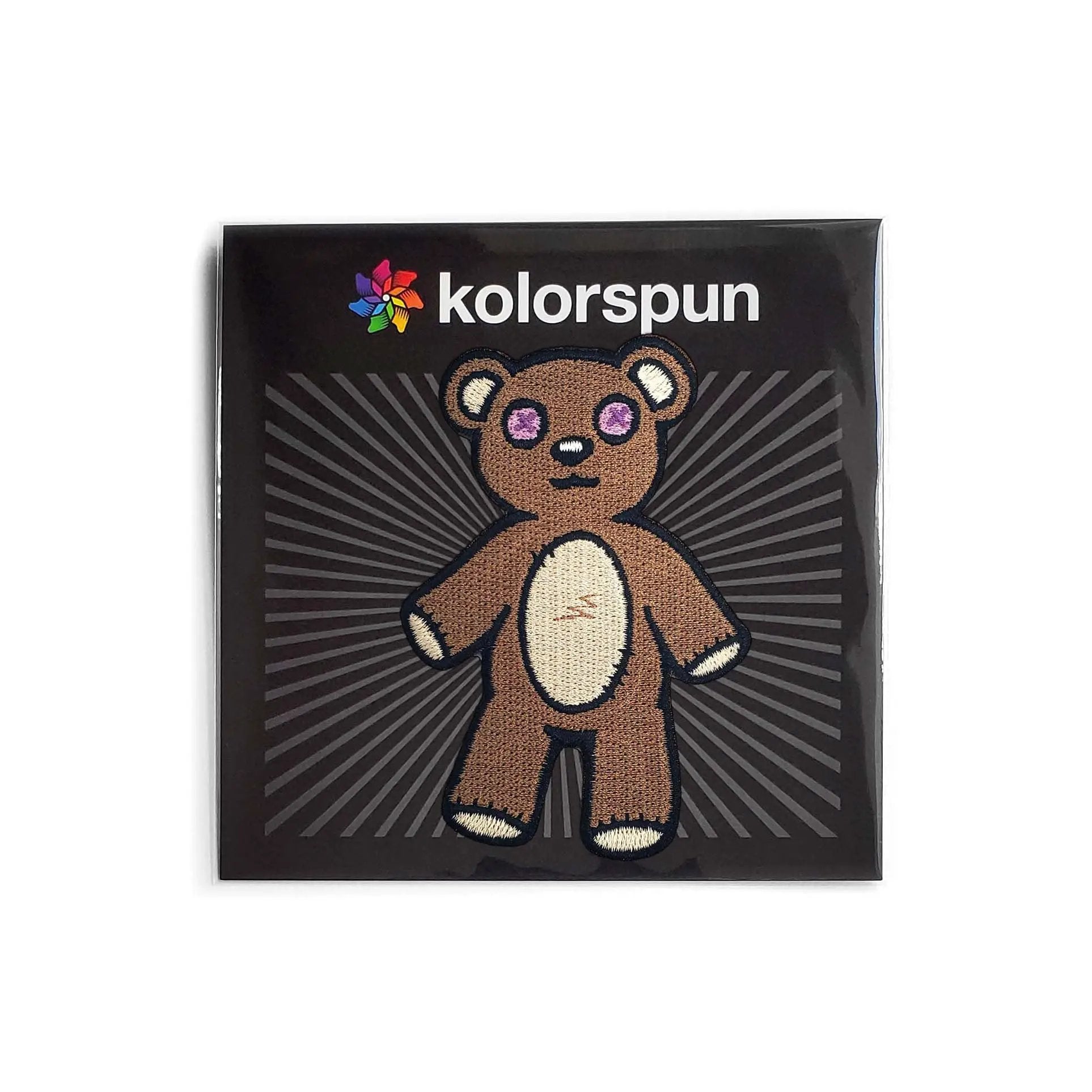 Kolorspun Teddy Bear Patch sewn onto fabric, featuring a cute embroidered teddy bear design for clothing or accessories.
