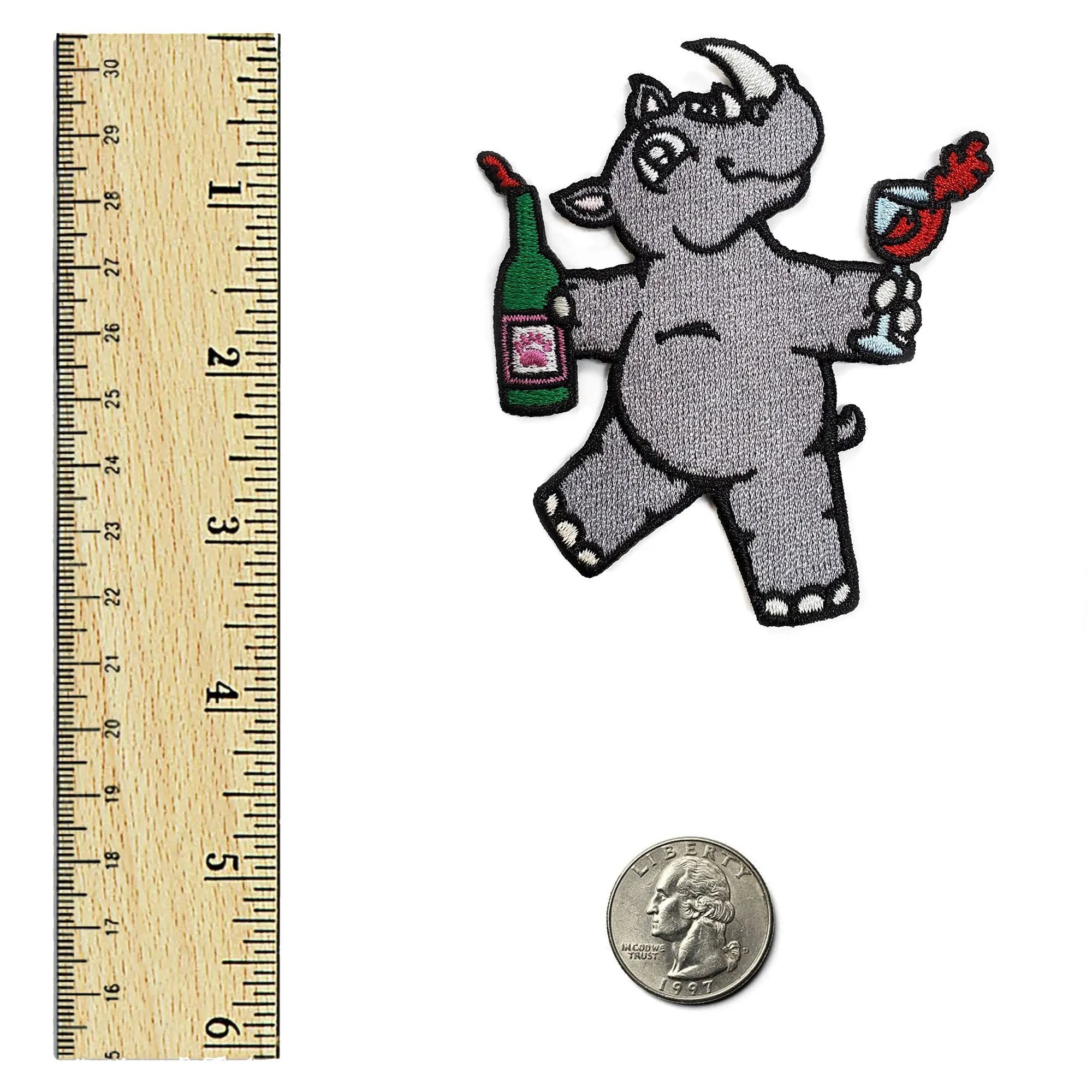 Kolorspun Whino Patch attached to a ruler, showcasing a colorful patch design suitable for clothing or accessories.
