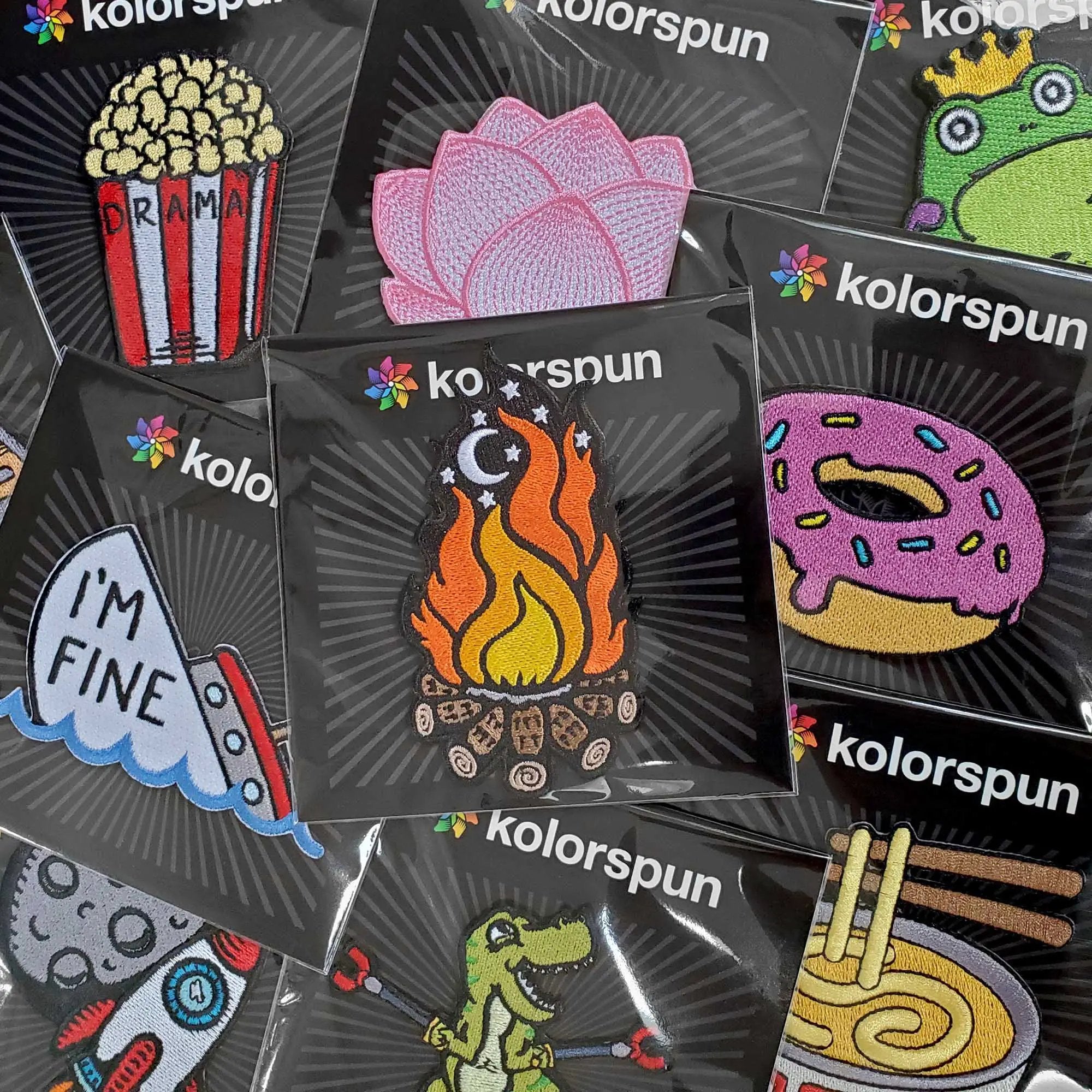 Kolorspun Whino patch with colorful embroidered design, packaged in a collection, perfect for clothing or accessories.