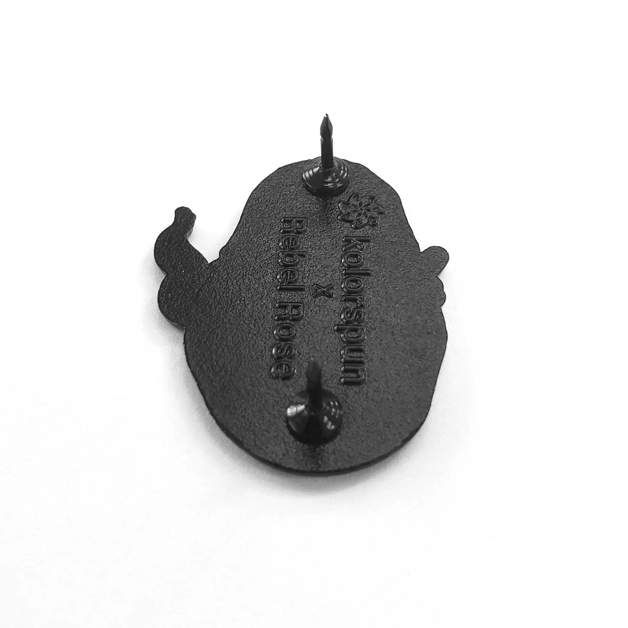 Kolorspun baked potato pin with a realistic design, showcasing a detailed, fun potato shape on a metal pin back.