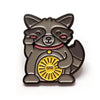 Kolorspun Lucky Raccoon enamel pin featuring a detailed raccoon design on a metal pin back.