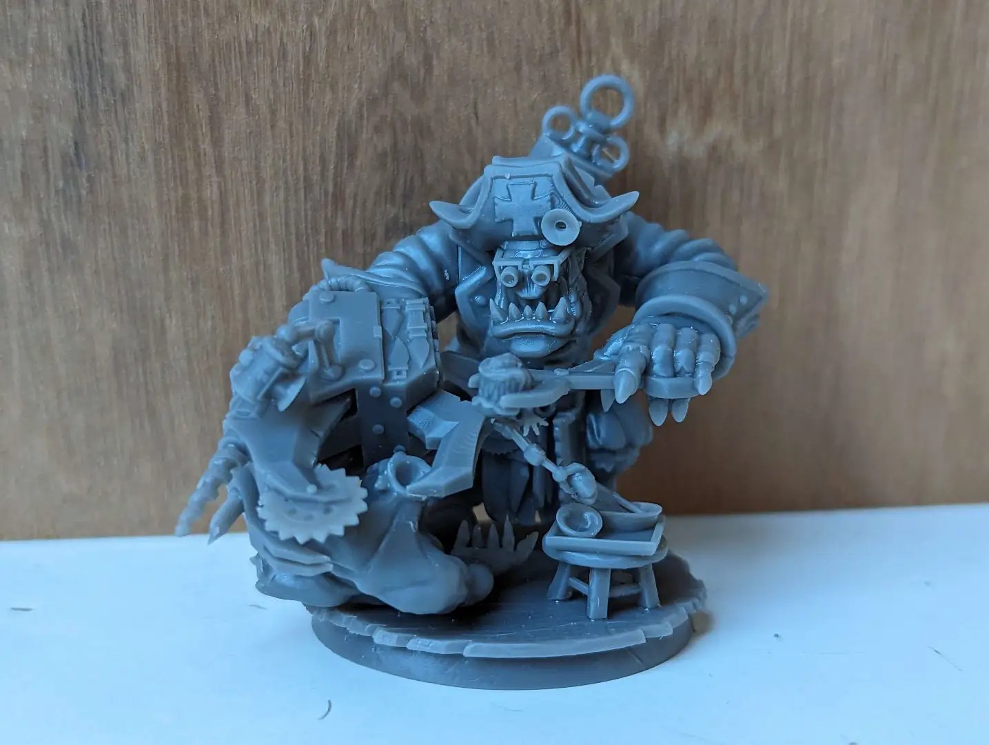 3D printed Ork Pirate Dokta miniature by Last Hope Miniatures, showing detailed green ork with pirate attire and prosthetic arm.