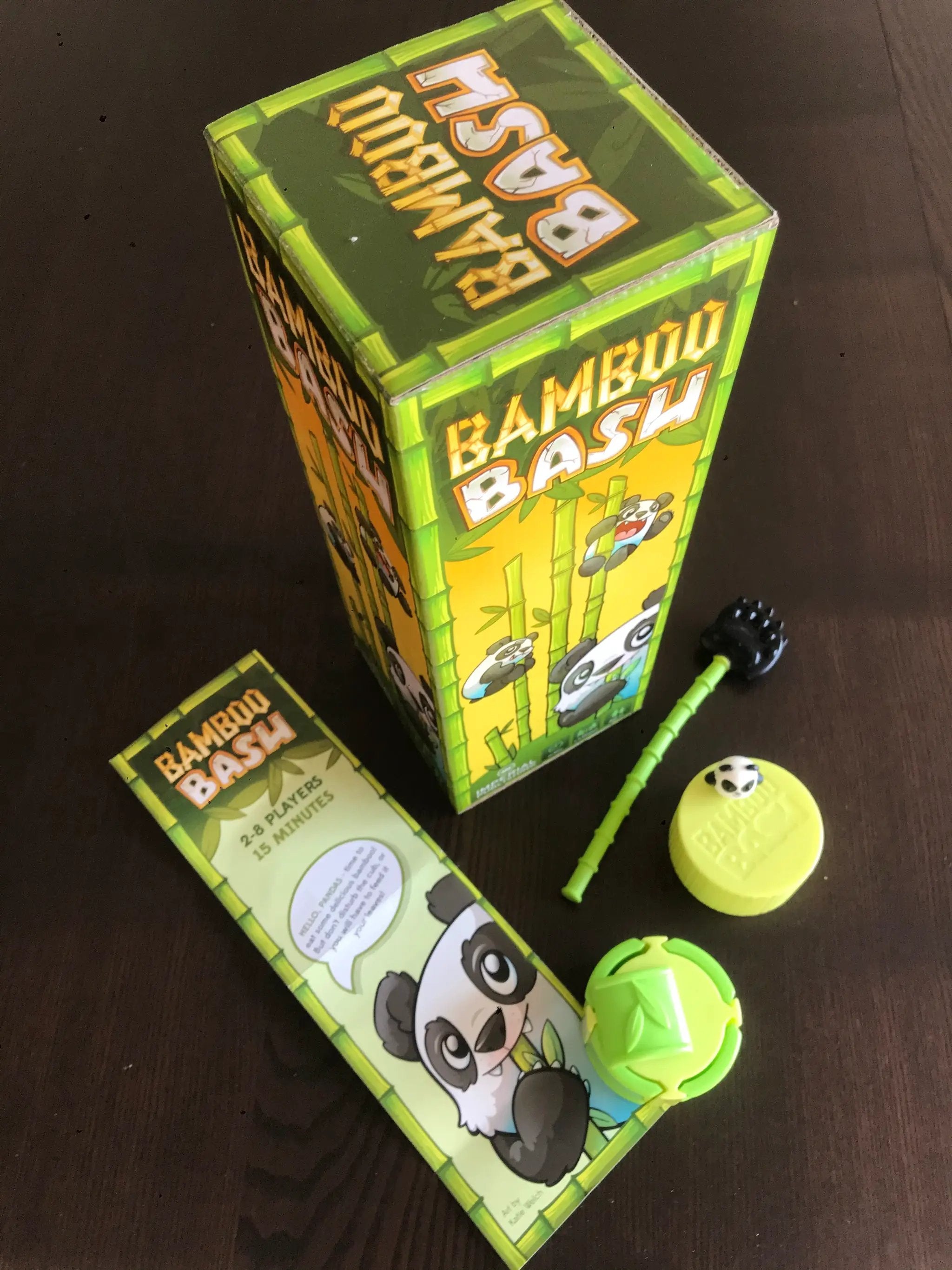 Mayday Games Bamboo Bash 2-8 Player Panda Dexterity Game components, including bamboo sticks and panda game pieces.
