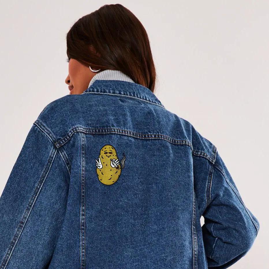 Kolorspun Baked Potato Patch sewn onto a jacket, showcasing a colorful embroidered potato patch for clothing decoration.