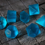 Blue zircon gemstone DND dice set with hand-carved glass design by Runic Dice, featuring a vibrant blue color and intricate detailing.