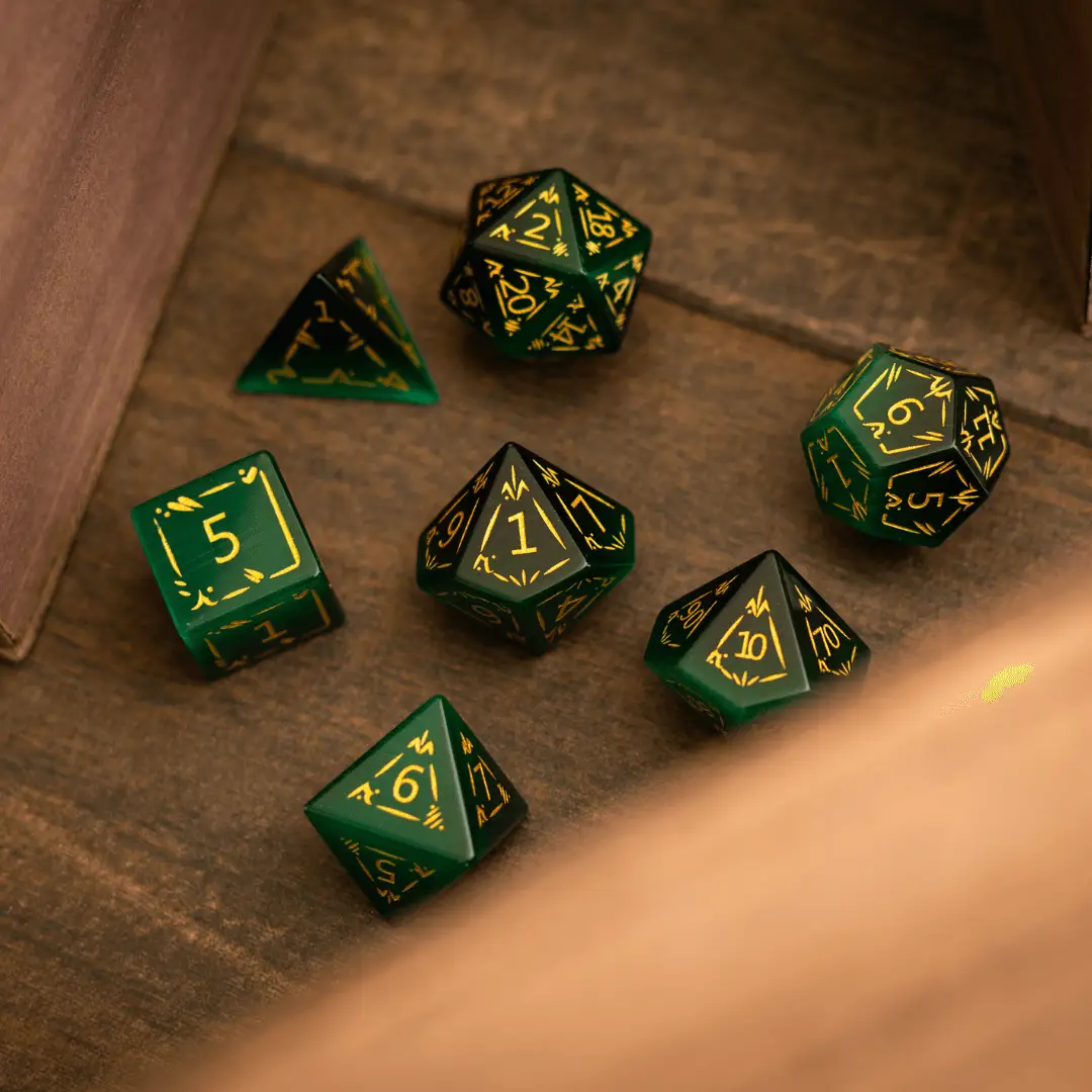 Green Cats Eye gemstone DND dice set by Runic Dice featuring dragon shield design and vibrant, polished gemstone surfaces.