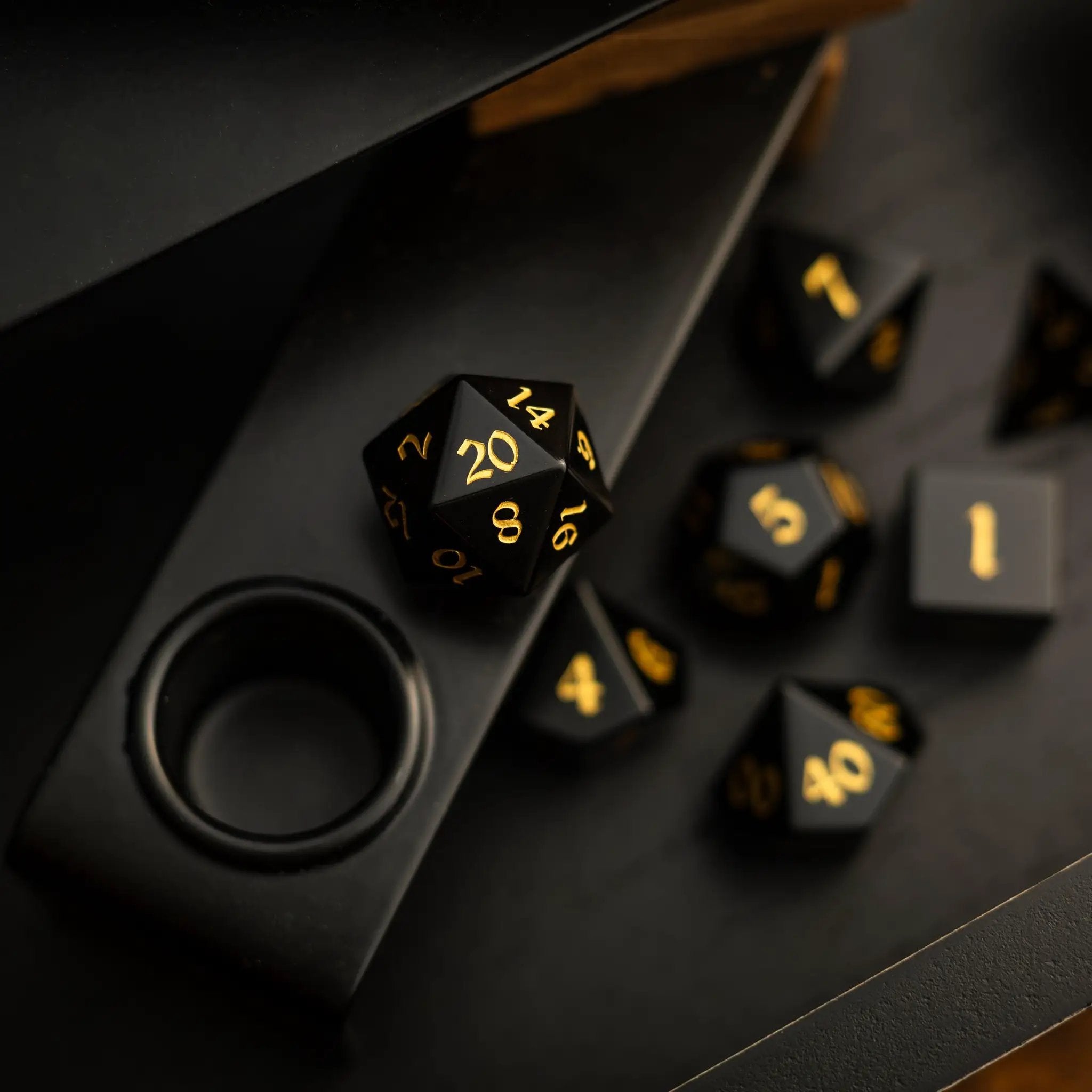 Runic Dice gemstone black night obsidian hand-carved DND dice set, featuring polished, detailed gemstone dice for tabletop gaming.