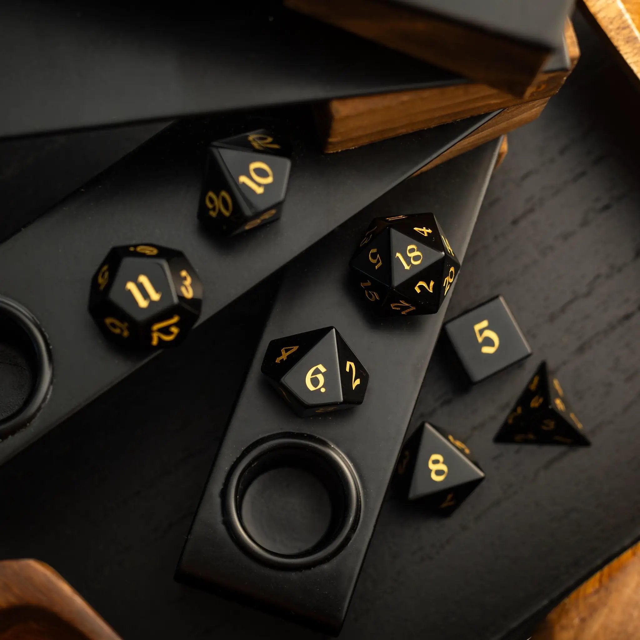 Black Night Obsidian gemstone DND dice set by Runic Dice, hand-carved gemstone dice for tabletop gaming.