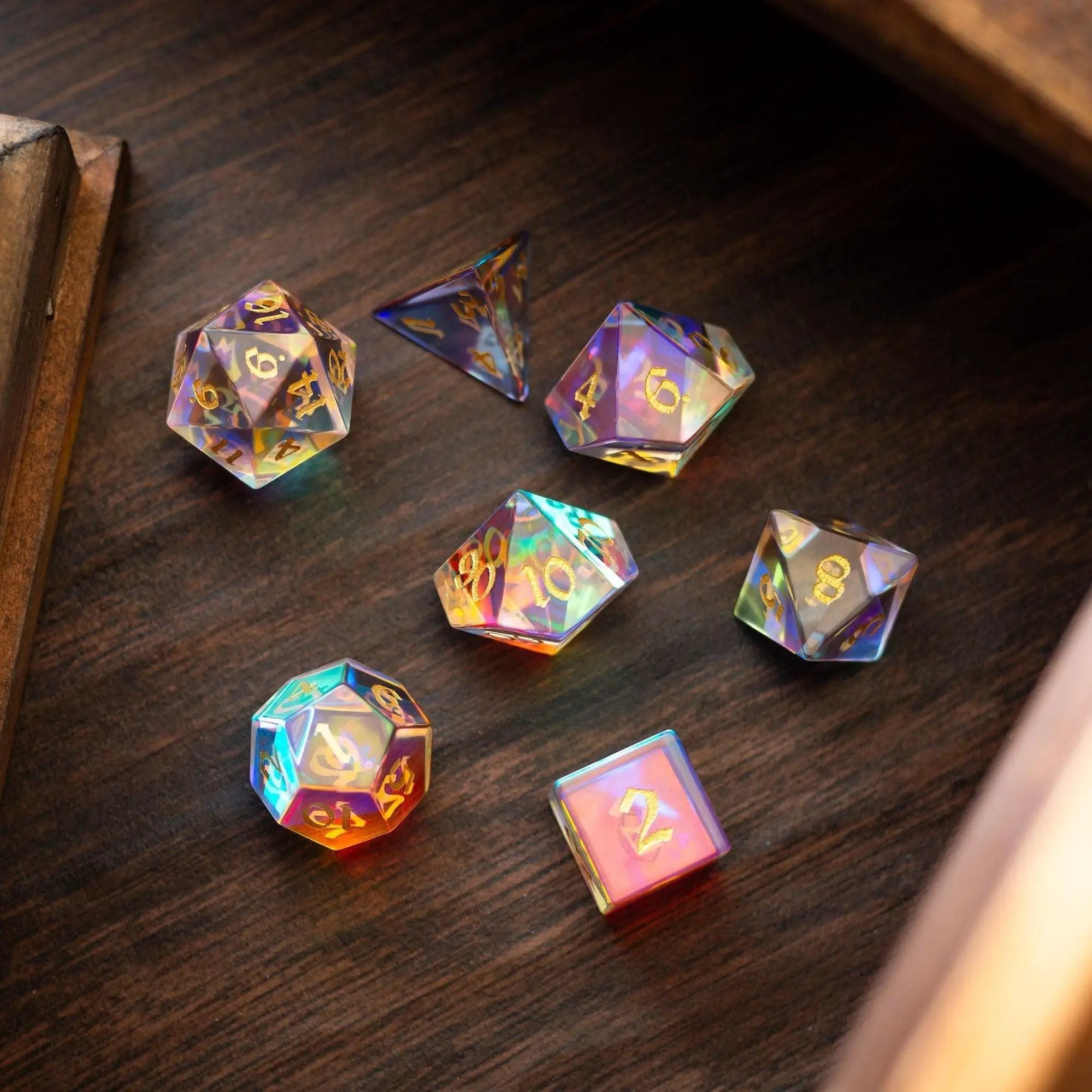 Hand-carved gemstone dichroic glass DND dice set by Runic Dice, featuring colorful, reflective gemstone dice for tabletop gaming.