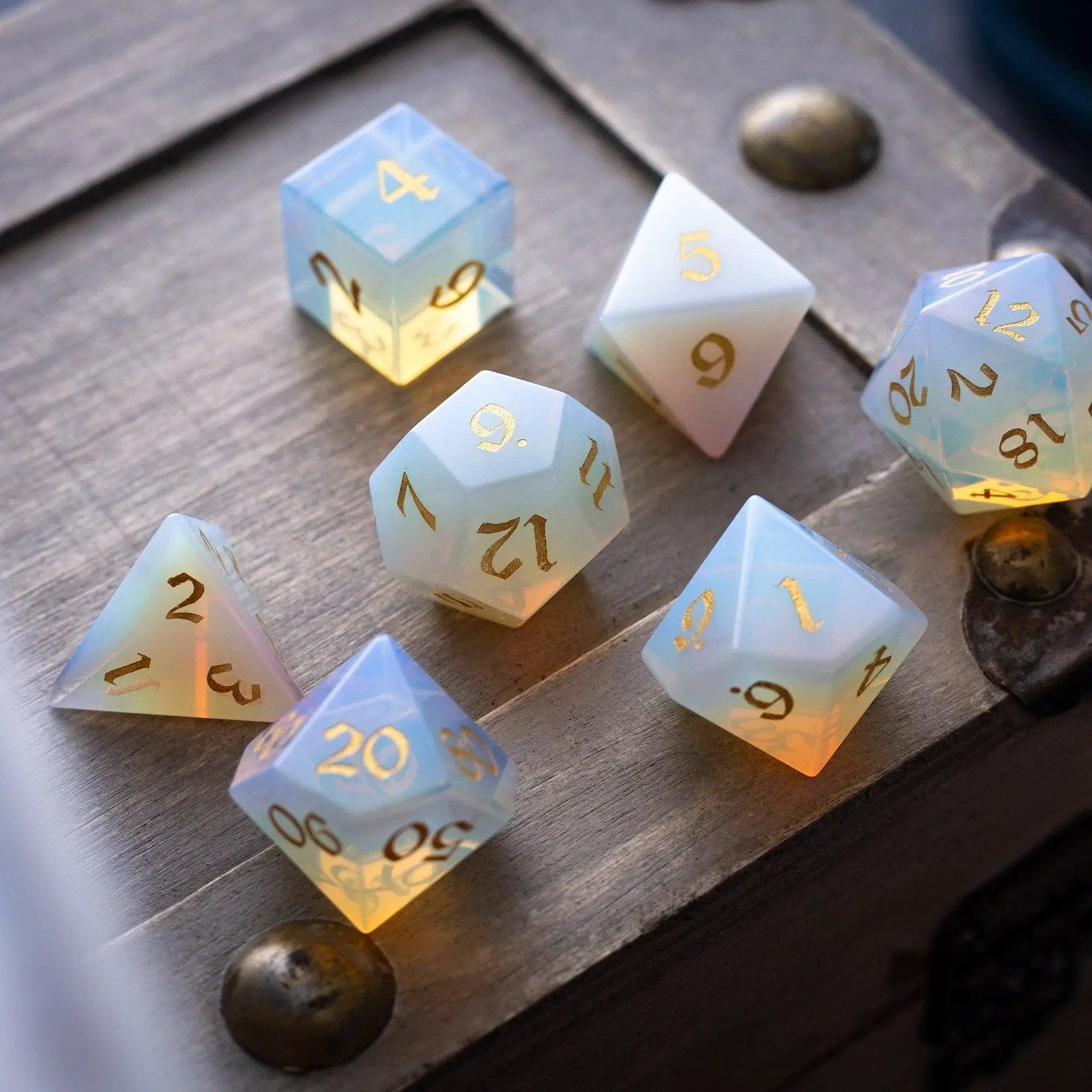 Runic Dice gemstone opalite DND dice set with gold font, hand-carved and polished, perfect for tabletop gaming and role-playing adventures.