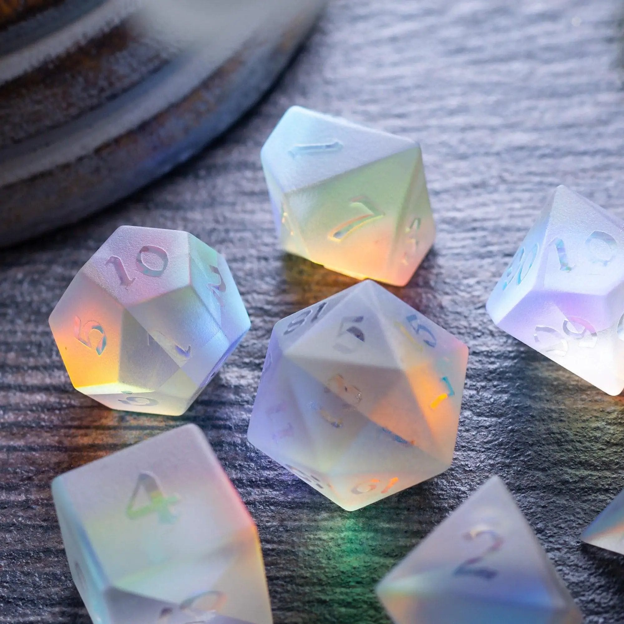 Set of gemstone raised dichroic glass DND dice from Runic Dice, featuring colorful, reflective gemstone-style gaming dice.