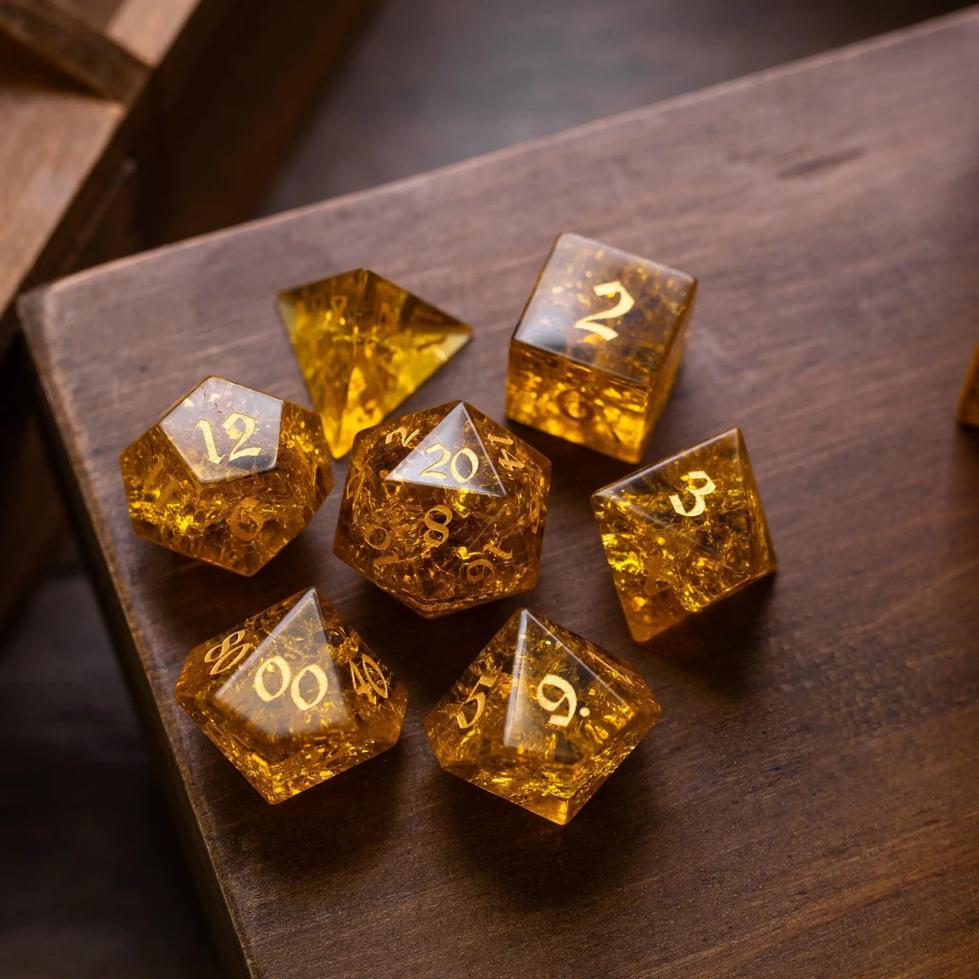 Gold honey lightning cracked glass gemstone dice set for DND by Runic Dice, featuring shimmering gold and cracked glass design.