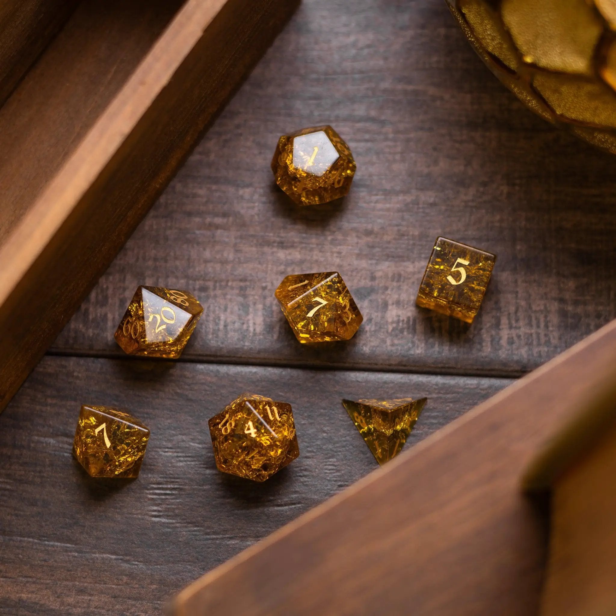 Gold honey lightning cracked glass gemstone D&D dice set by Runic Dice featuring intricate crackled design and vibrant gold color.