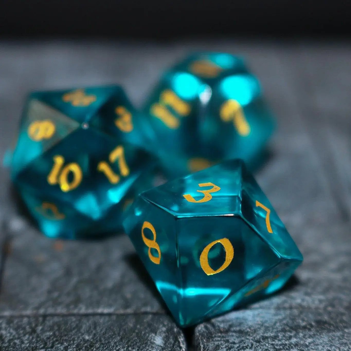 Green zircon glass gemstone DND dice set hand carved by Runic Dice, featuring vibrant green, polished, and textured surface details.