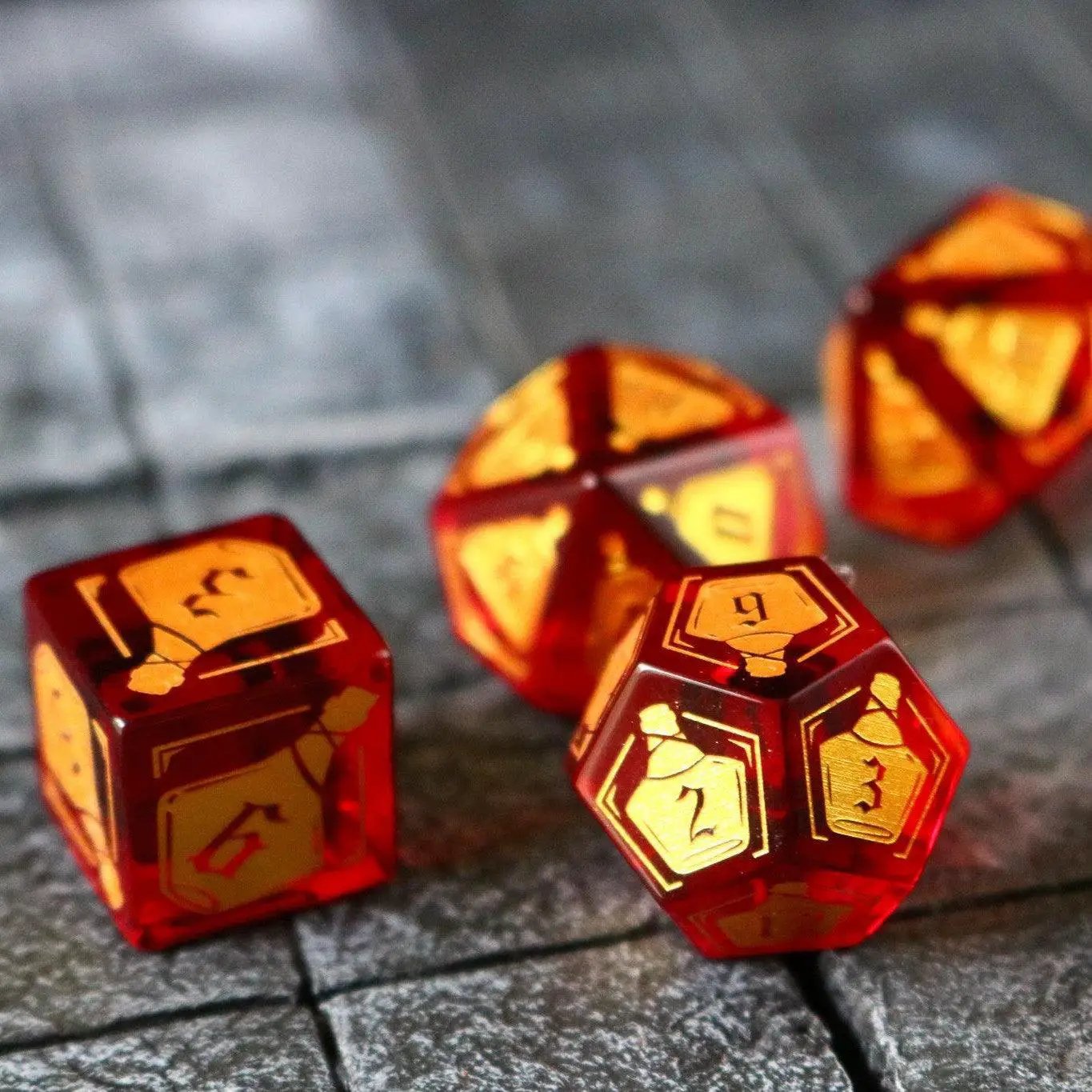 Red zircon gemstone DND dice set by Runic Dice featuring a health potion design and clear glass craftsmanship.
