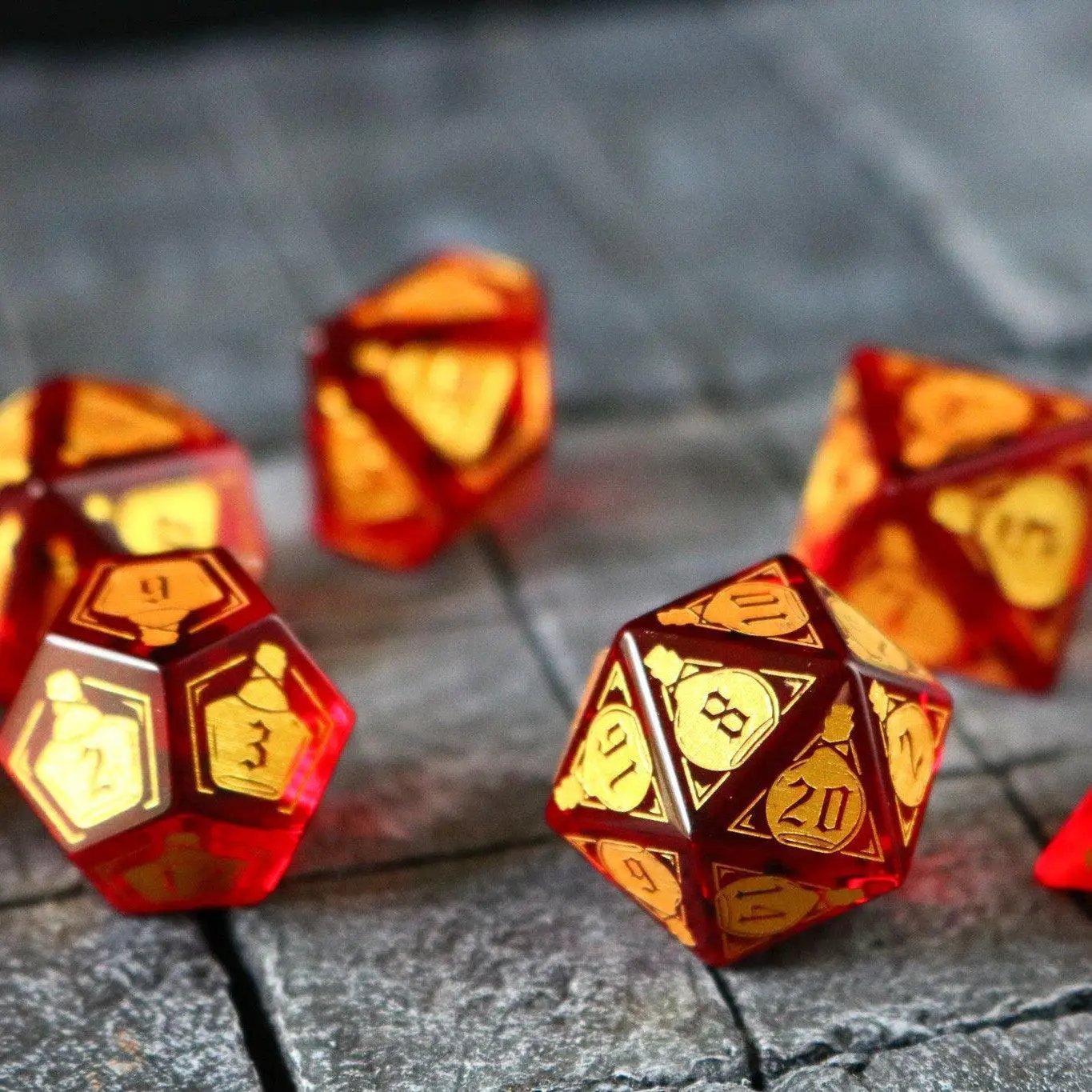 Red zircon gemstone DND dice set by Runic Dice featuring health potion-inspired design and transparent glass material.