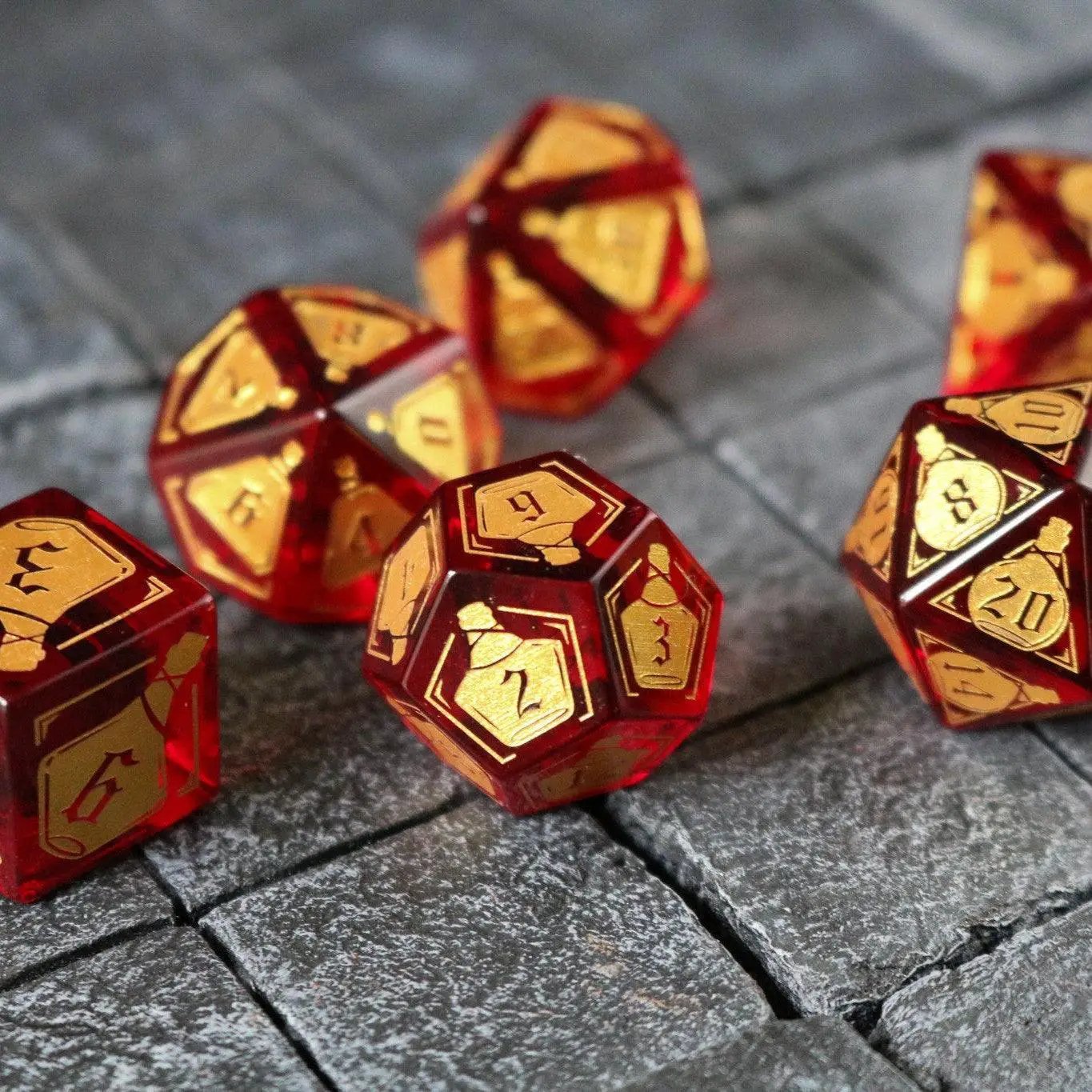 Red zircon gemstone DND dice set by Runic Dice, featuring a health potion design with clear glass and vibrant red coloring.