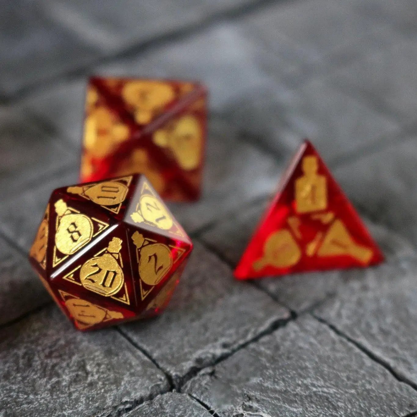 Red zircon gemstone dice set by Runic Dice featuring health potion-inspired DND glass dice for tabletop gaming.