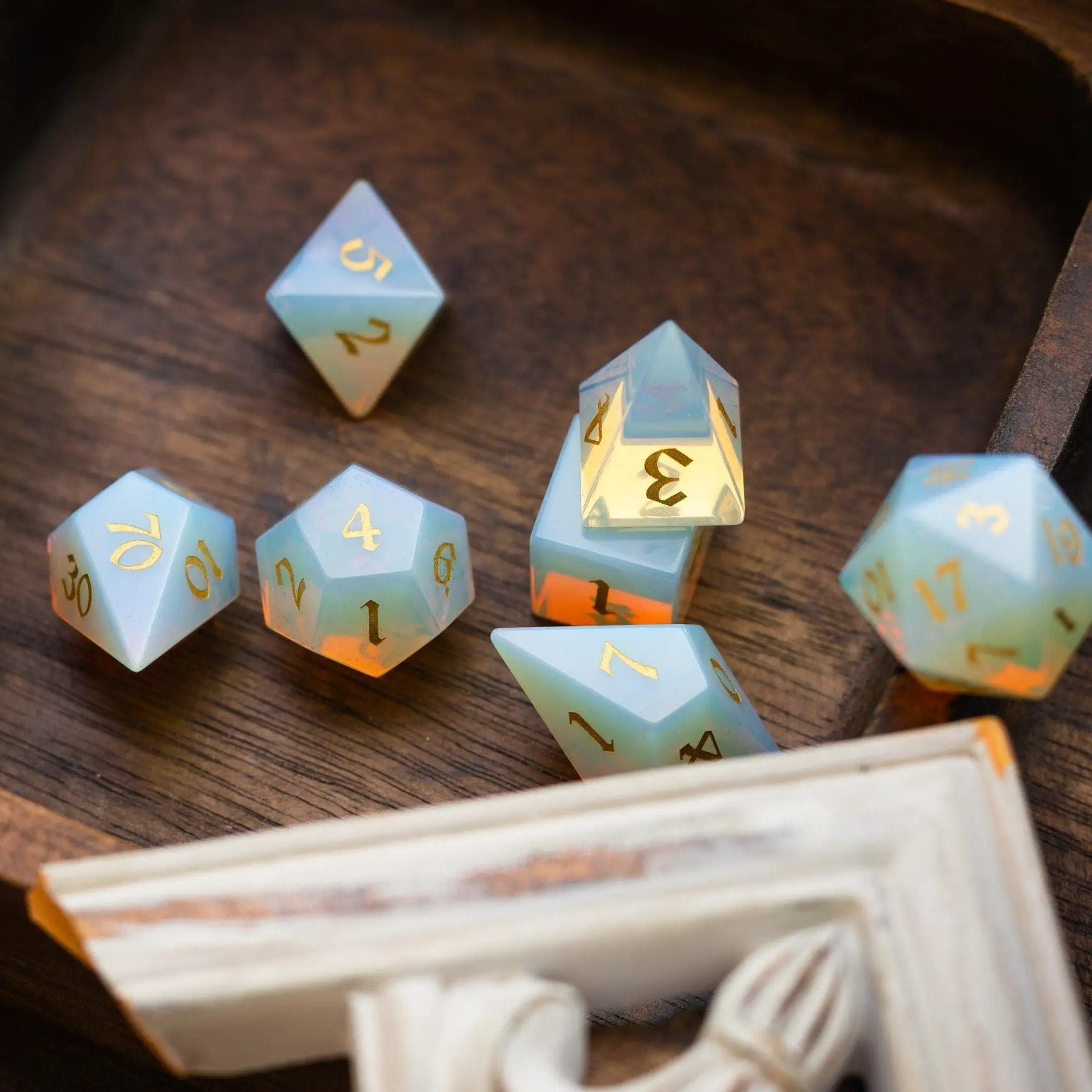 Opalite gemstone DND dice set with elven cut design by Runic Dice, featuring colorful, faceted gemstone dice for tabletop gaming.
