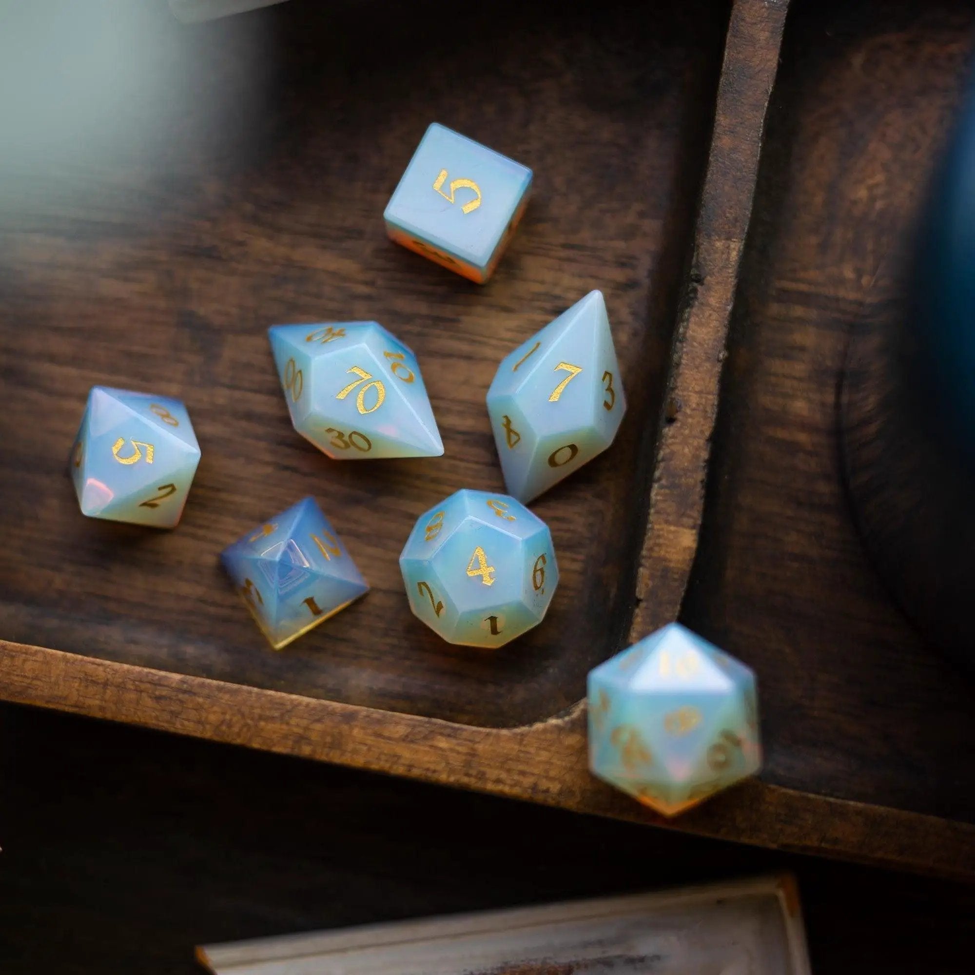 Runic Dice gemstone opalite elven cut DND dice set with intricately carved, colorful gemstone dice for tabletop gaming.