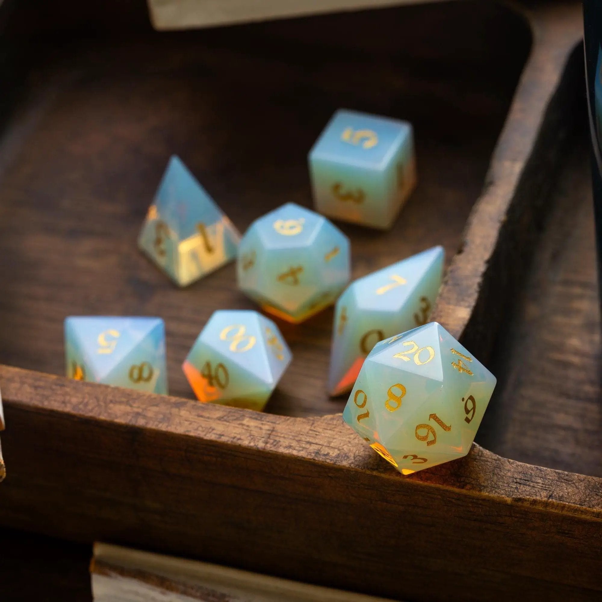 Opalite gemstone Elven cut DND dice set by Runic Dice, featuring shimmering, multi-faceted gemstone dice for tabletop gaming.