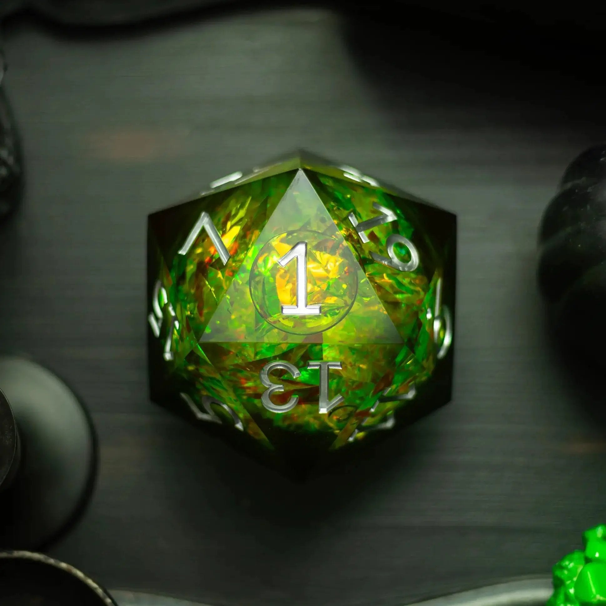 Green resin chonk D20 die with liquid core, handmade by Runic Dice, shown alongside its storage box.
