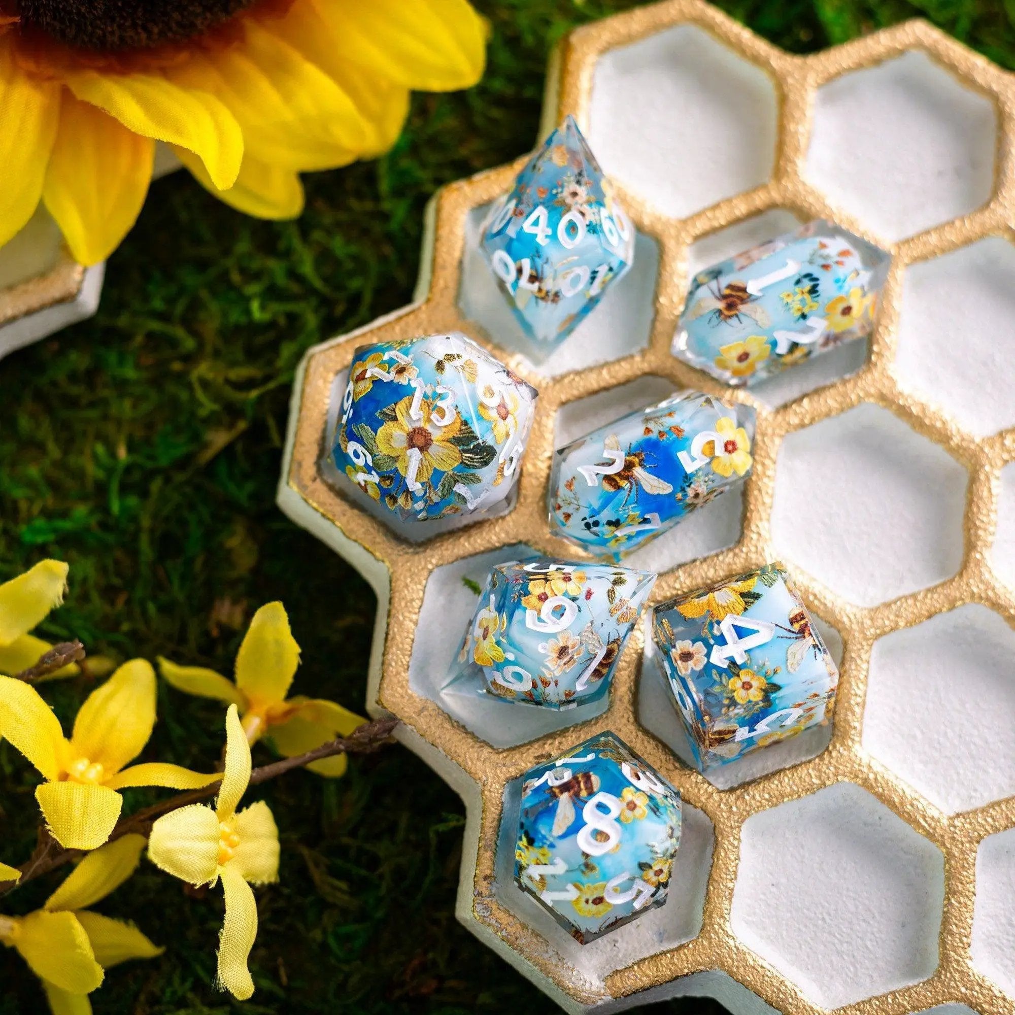 Handmade resin DND dice set featuring bees and flowers, crafted by Runic Dice with detailed, colorful designs.
