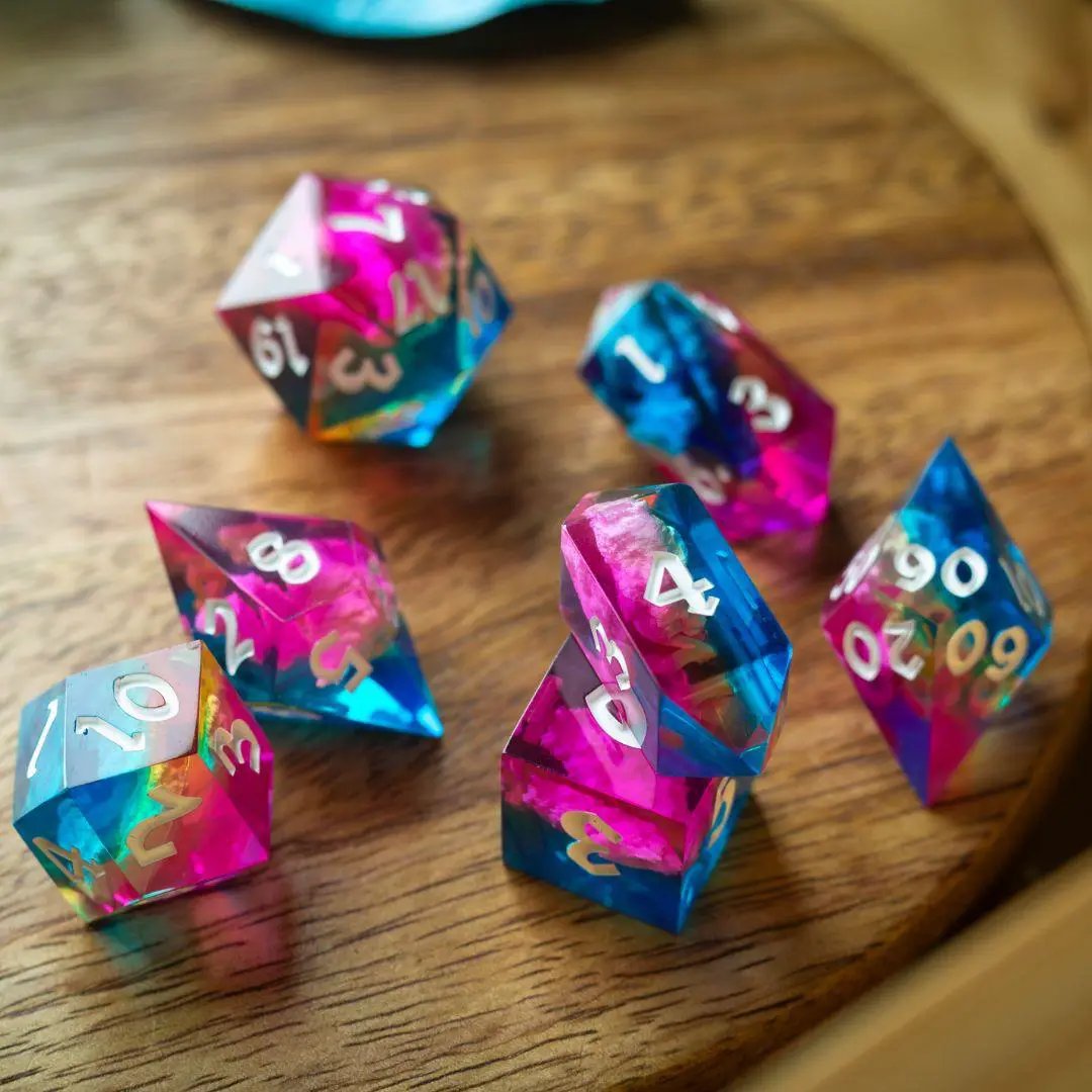 Runic Dice Starlit Rift resin DND dice set featuring shimmering, cosmic-inspired dice with vibrant colors and intricate patterns.
