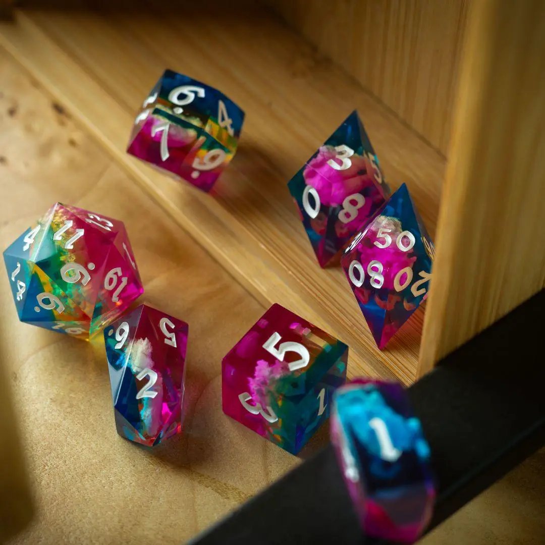 Runic Dice Starlit Rift resin DND dice set with shimmering cosmic design, featuring various numbered polyhedral dice.